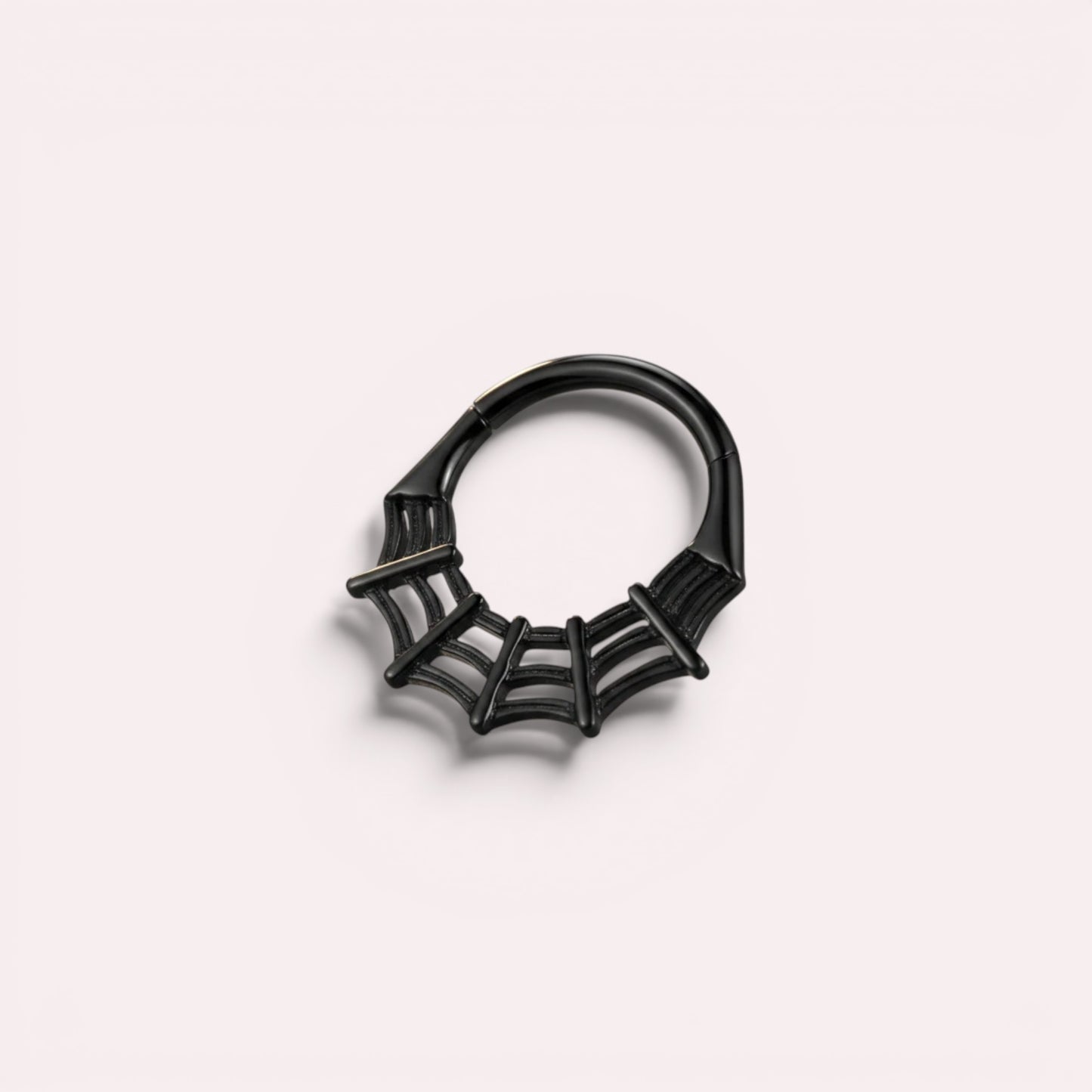 MKBodyJewelry black spider web septum clicker ring made of surgical steel, 16g thickness, available in 8mm and 10mm.