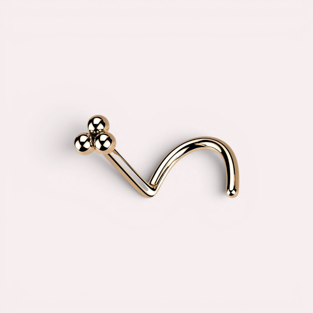 MKBodyJewelry rose gold triple ball nose screw with a polished finish for a sophisticated facial piercing look.