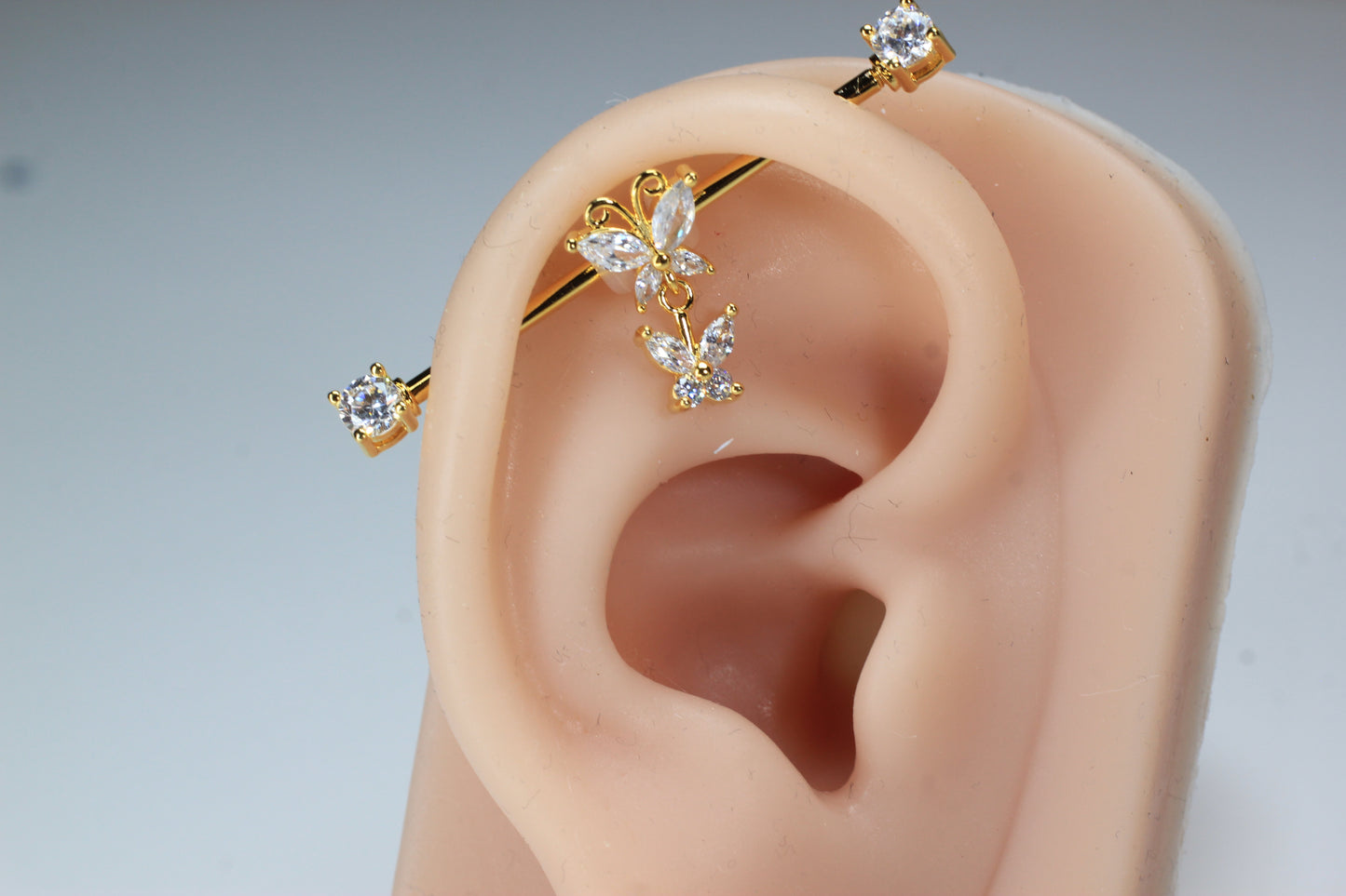Dangling Gold Butterfly Industrial Barbell.