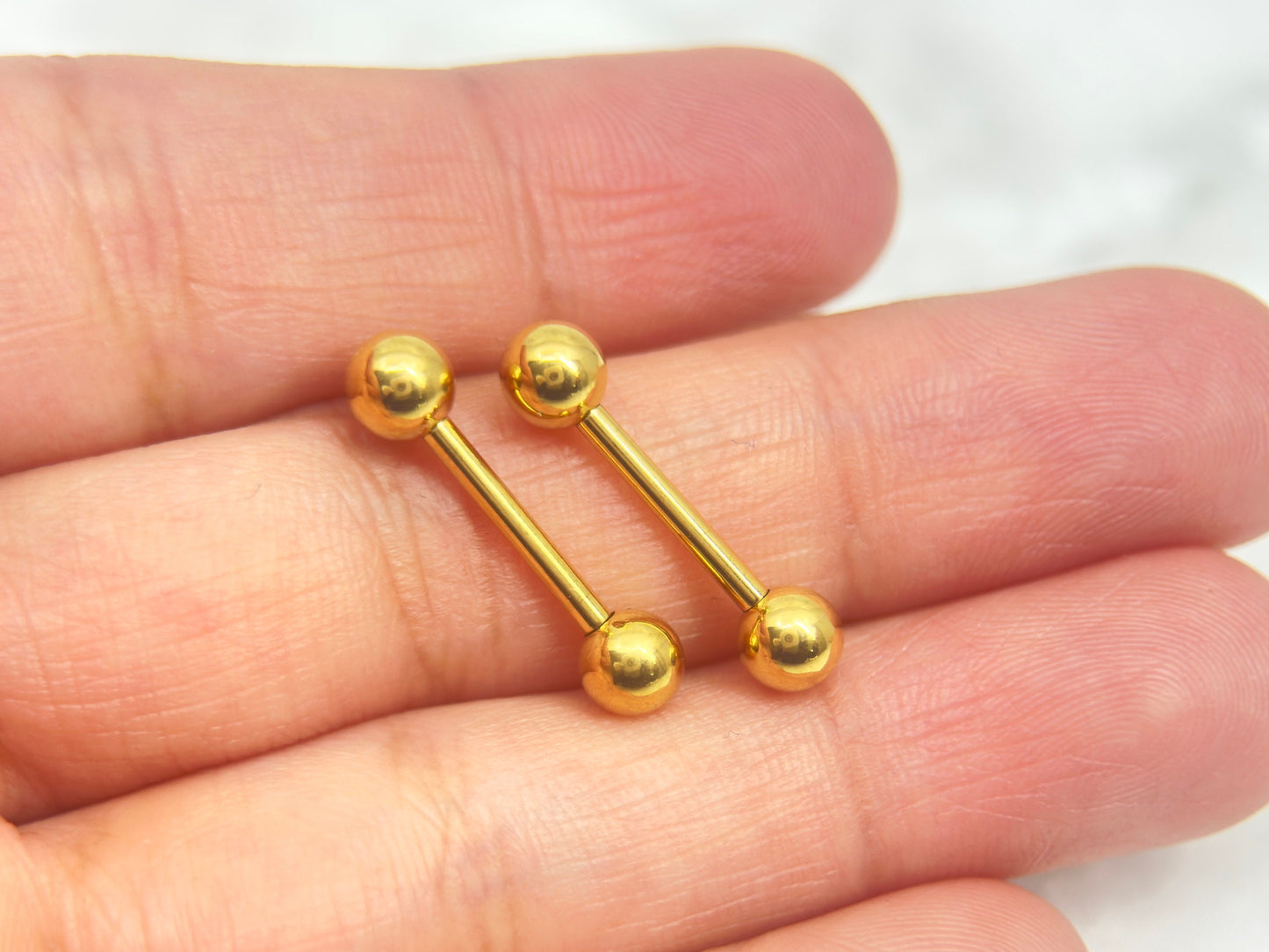 Internally Threaded Gold Nipple Barbell.