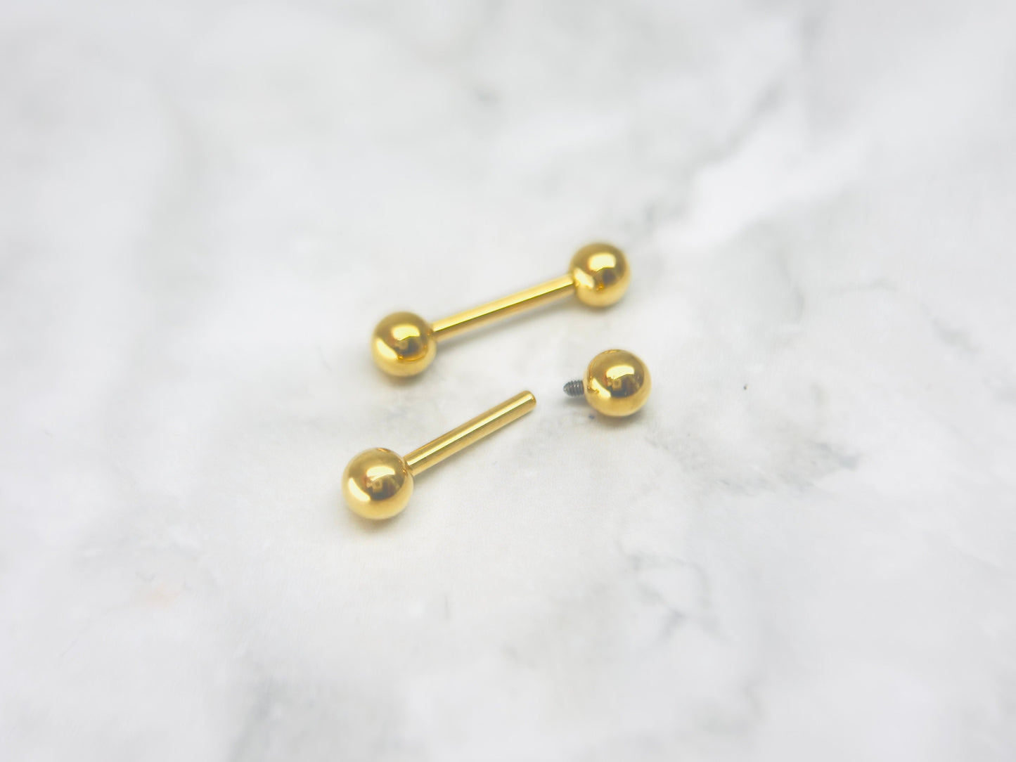 Internally Threaded Gold Nipple Barbell.