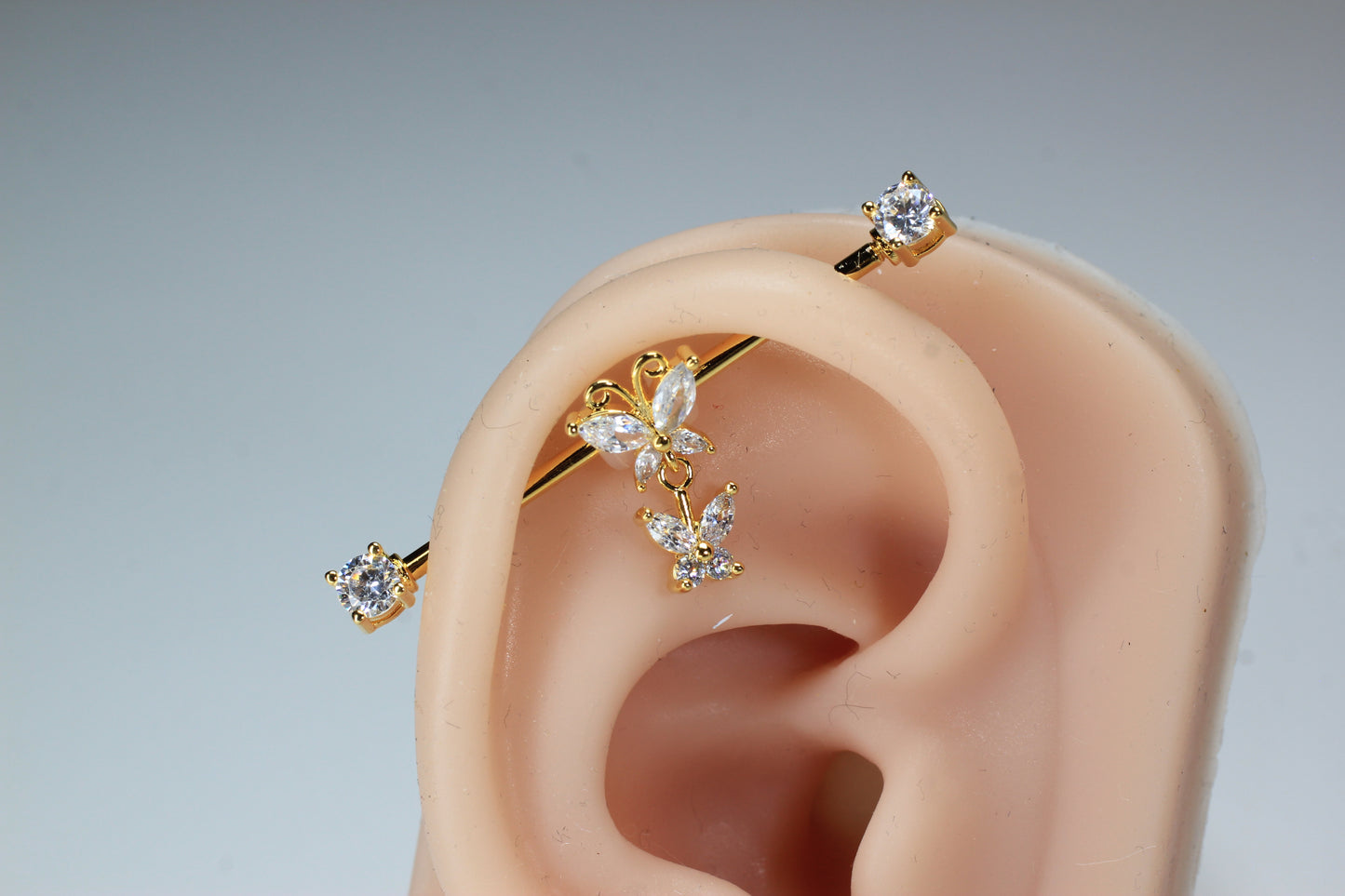 Dangling Gold Butterfly Industrial Barbell.