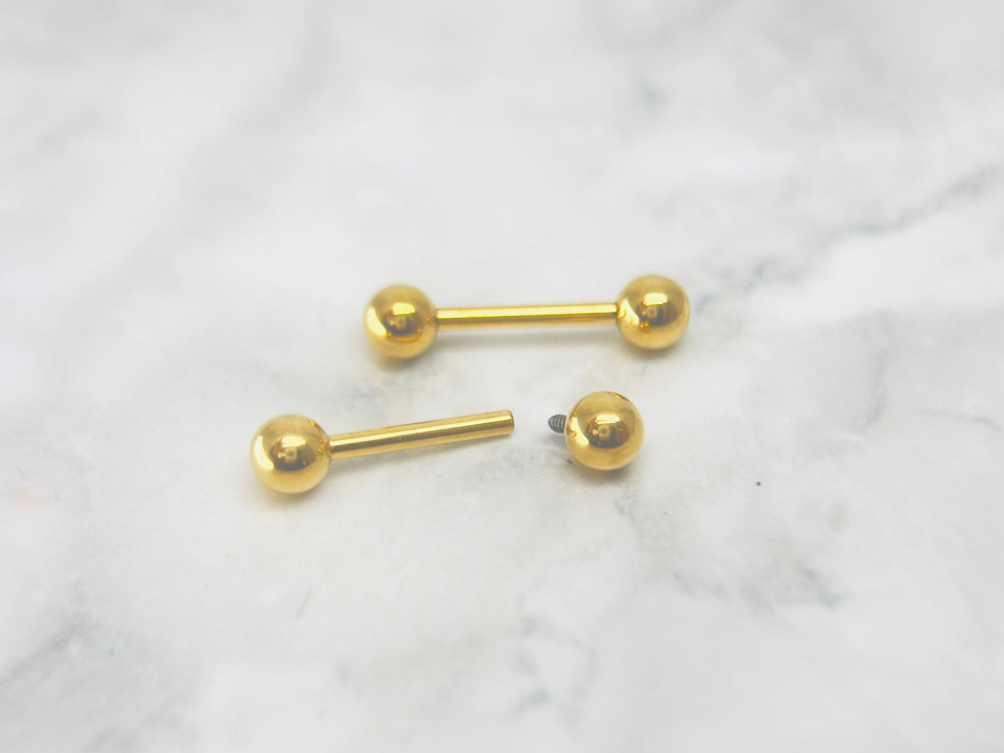Internally Threaded Gold Nipple Barbell.
