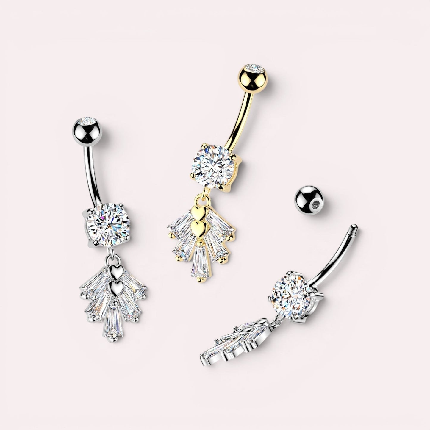 MKBodyJewelry gold-tone and silver-tone belly button ring with heart and baguette gems. Surgical stainless steel navel jewelry.