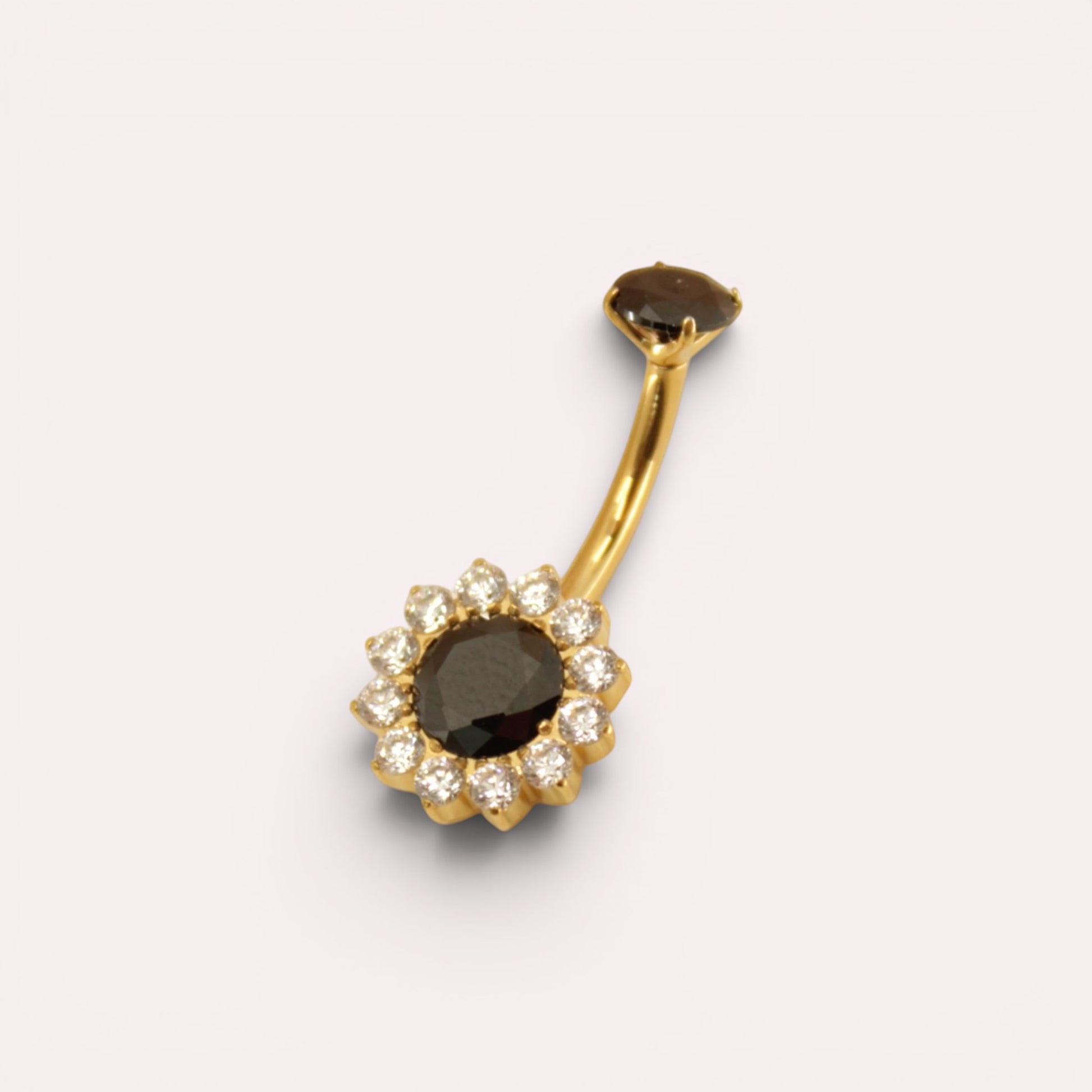 MKBodyJewelry 14g titanium belly button ring with a black floral gemstone design and gold-tone curved barbell.