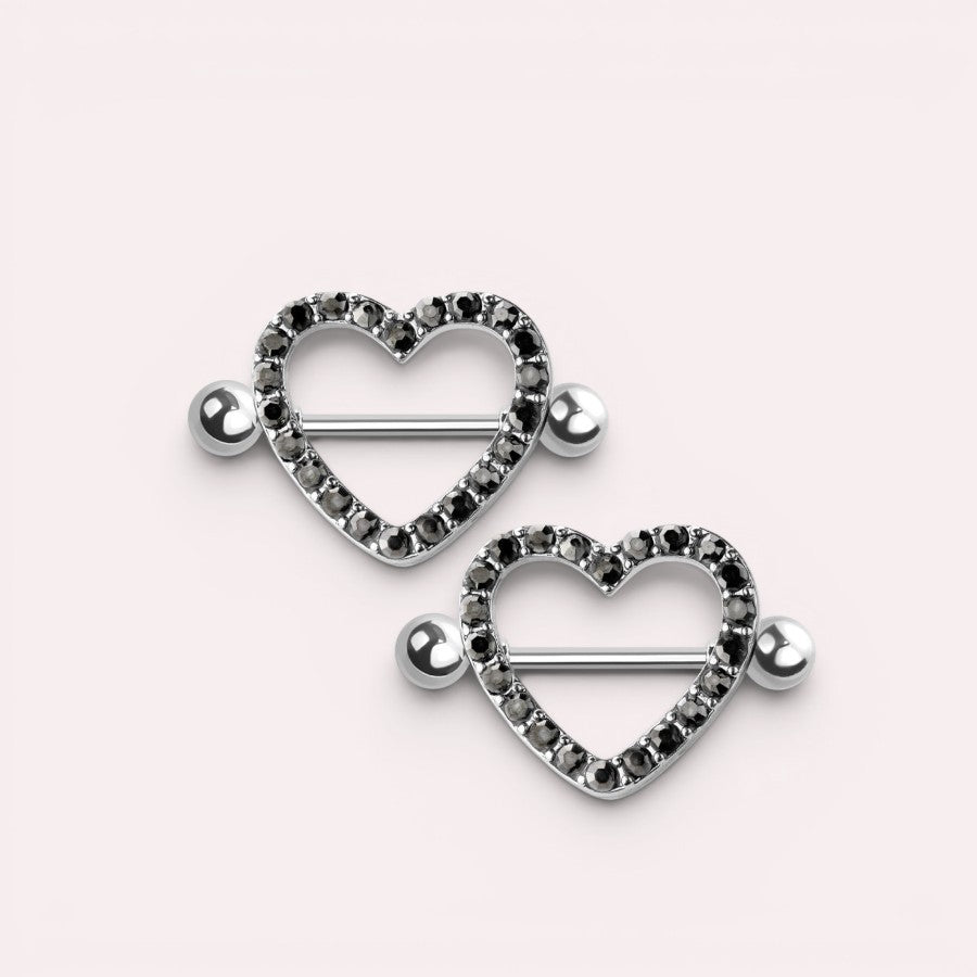 MKBodyJewelry 14G surgical steel nipple barbell featuring a silver heart shield paved with black gemstones.