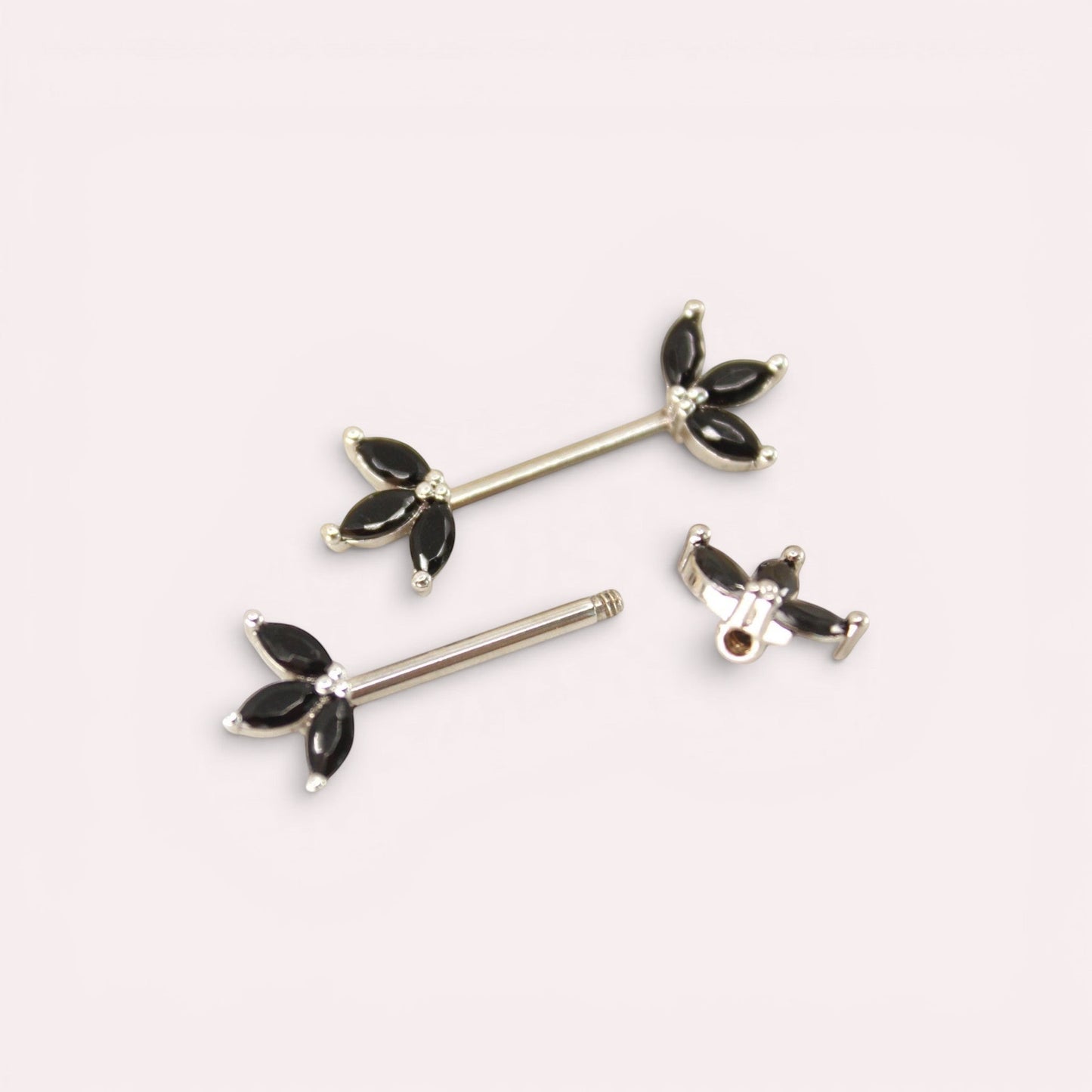 MKBodyJewelry black marquise leaf nipple barbells made of surgical steel, 14g. Sold as a pair.