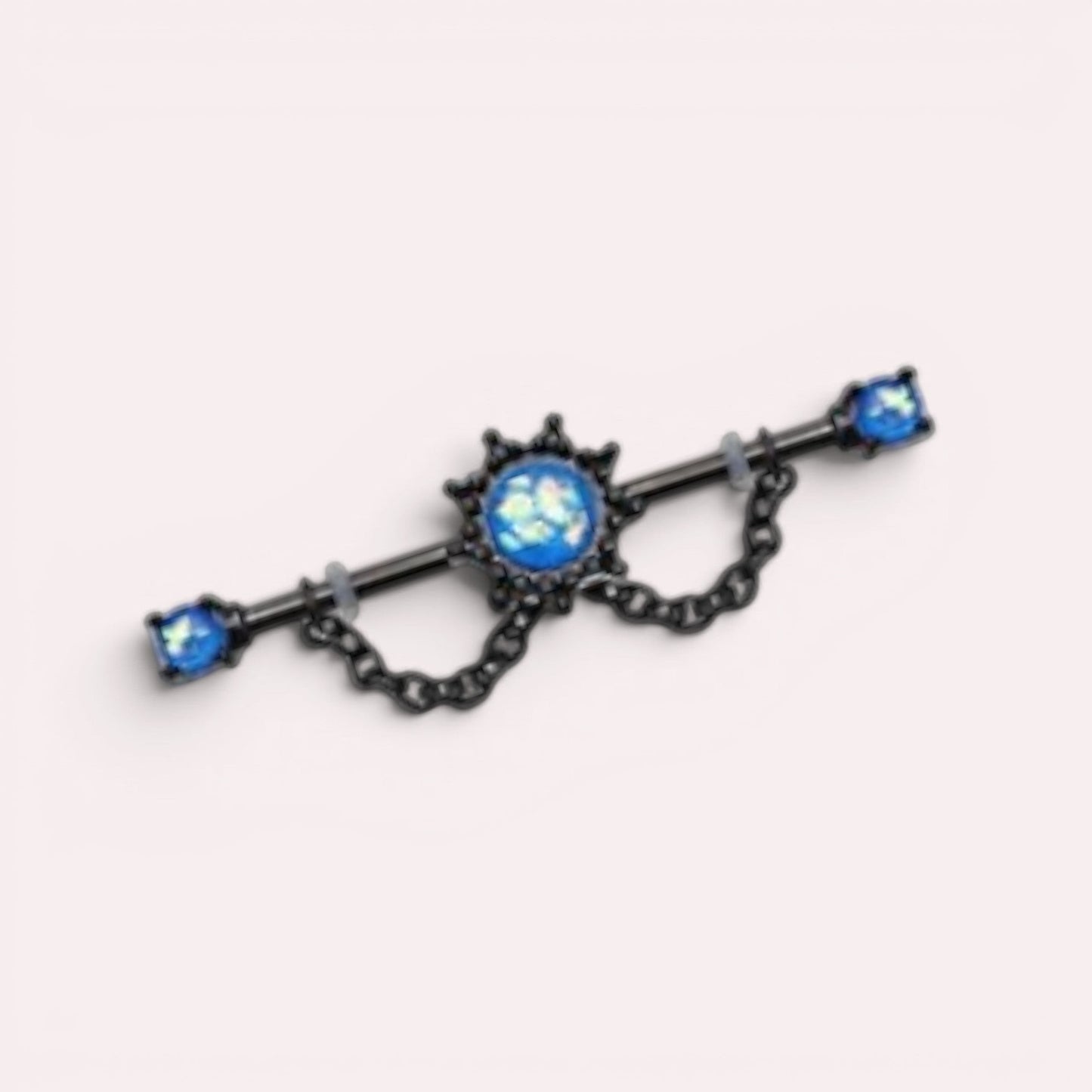 MKBodyJewelry 14G black surgical steel industrial barbell with blue opal star charm and dangling chain detail.