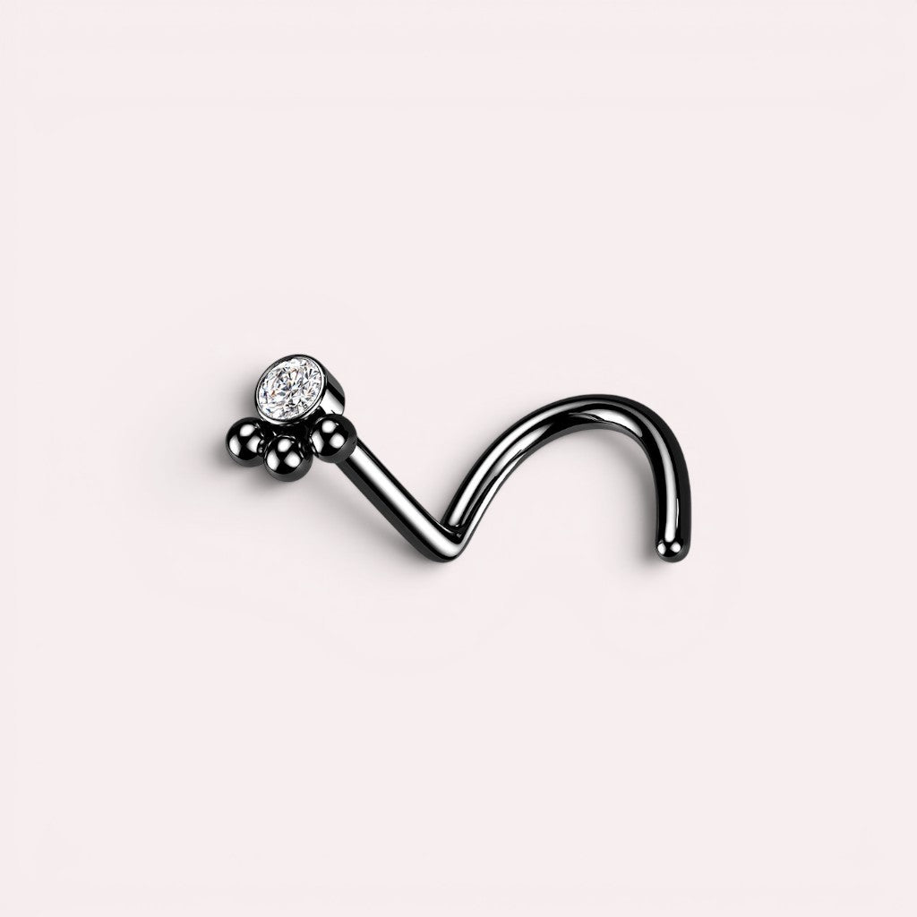 MKBodyJewelry black stainless steel 20G L-shape nose stud featuring a dainty paw print design with a clear crystal.