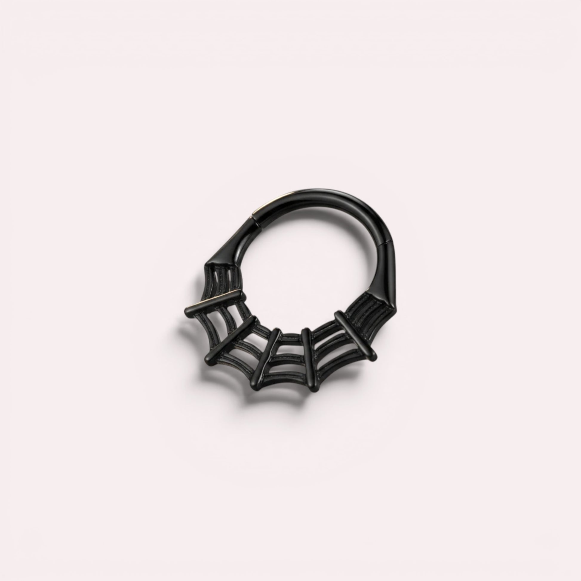 MKBodyJewelry black spider web septum clicker ring made of surgical steel, 16g thickness, available in 8mm and 10mm.
