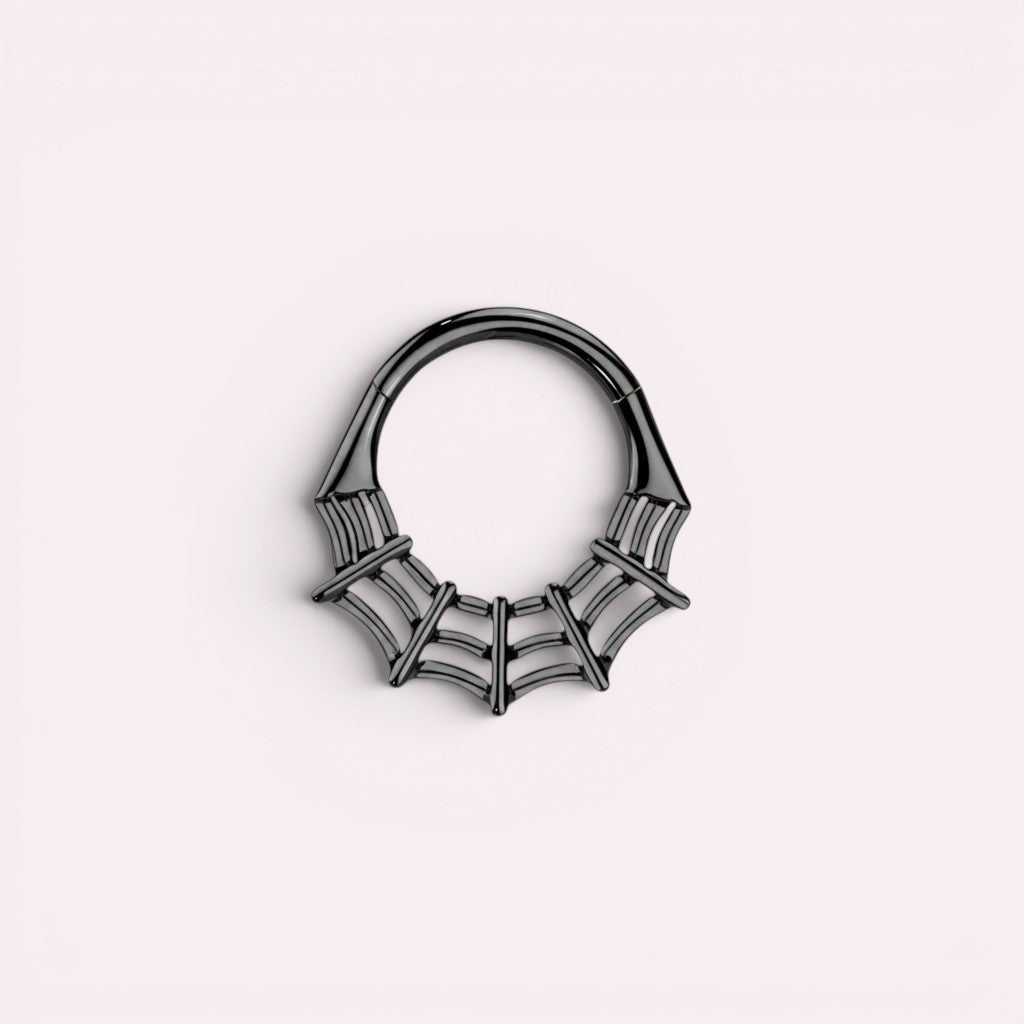 MKBodyJewelry black surgical steel 16g spider web septum clicker ring with hinged segment hoop design.