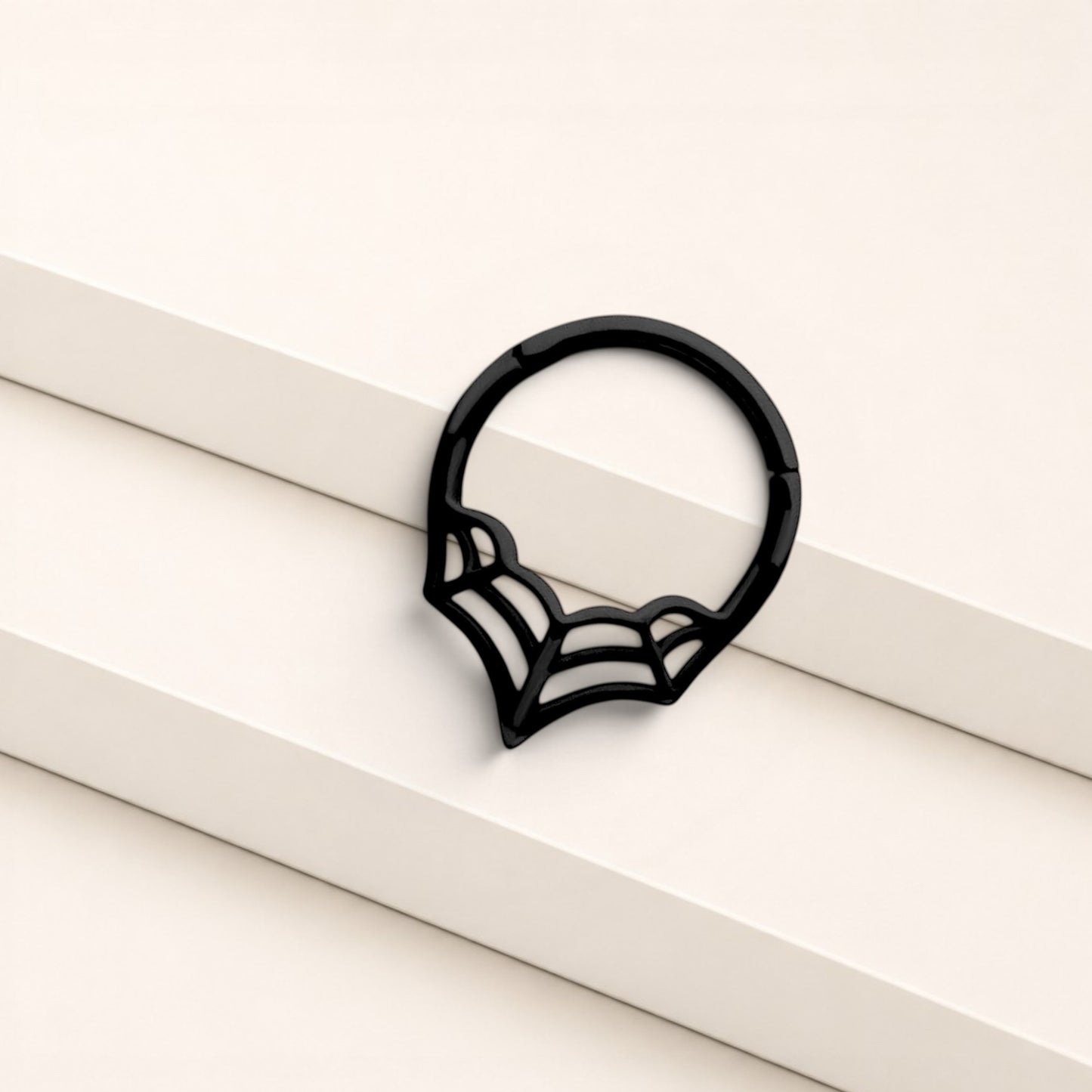 MKBodyJewelry 16G black surgical steel septum clicker ring featuring a minimalist spider web design for body piercings.