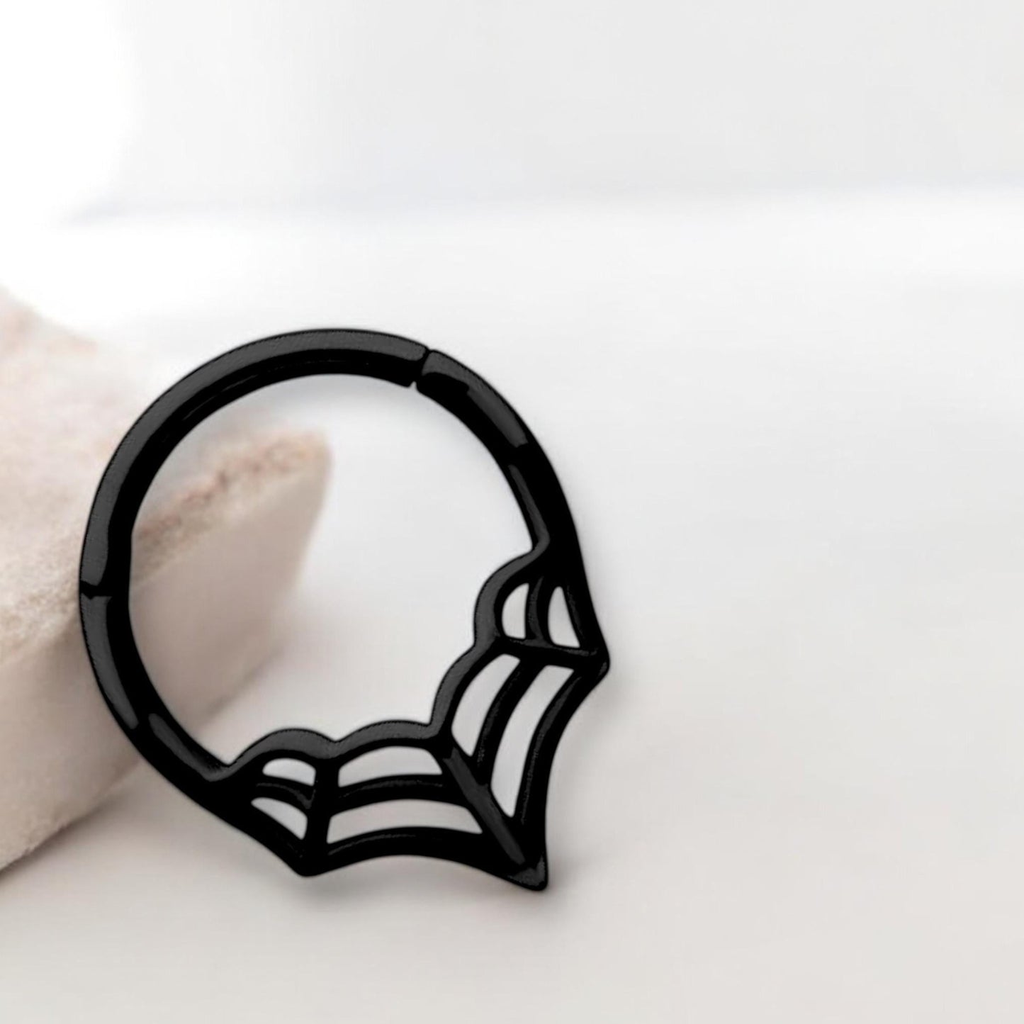 MKBodyJewelry black surgical steel spider web septum clicker ring with a hinged segment for daith or cartilage