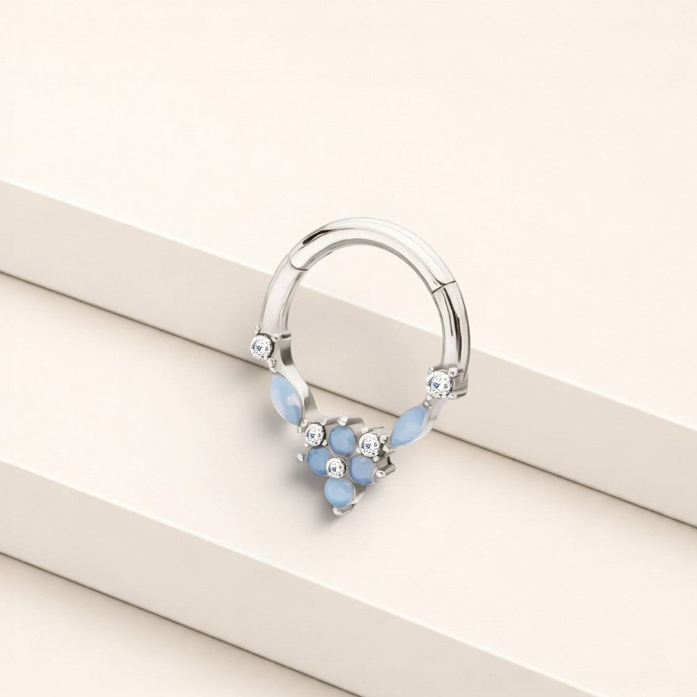 MKBodyJewelry surgical steel septum clicker ring featuring blue opal floral gems and clear stones in a hinged hoop design