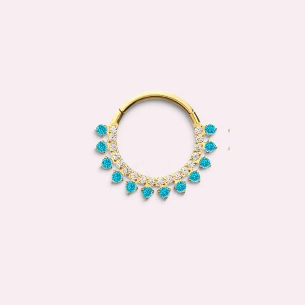 MKBodyJewelry gold septum clicker ring with blue topaz and clear cz stones. Implant grade titanium, 16g, 8mm/10mm diameter.