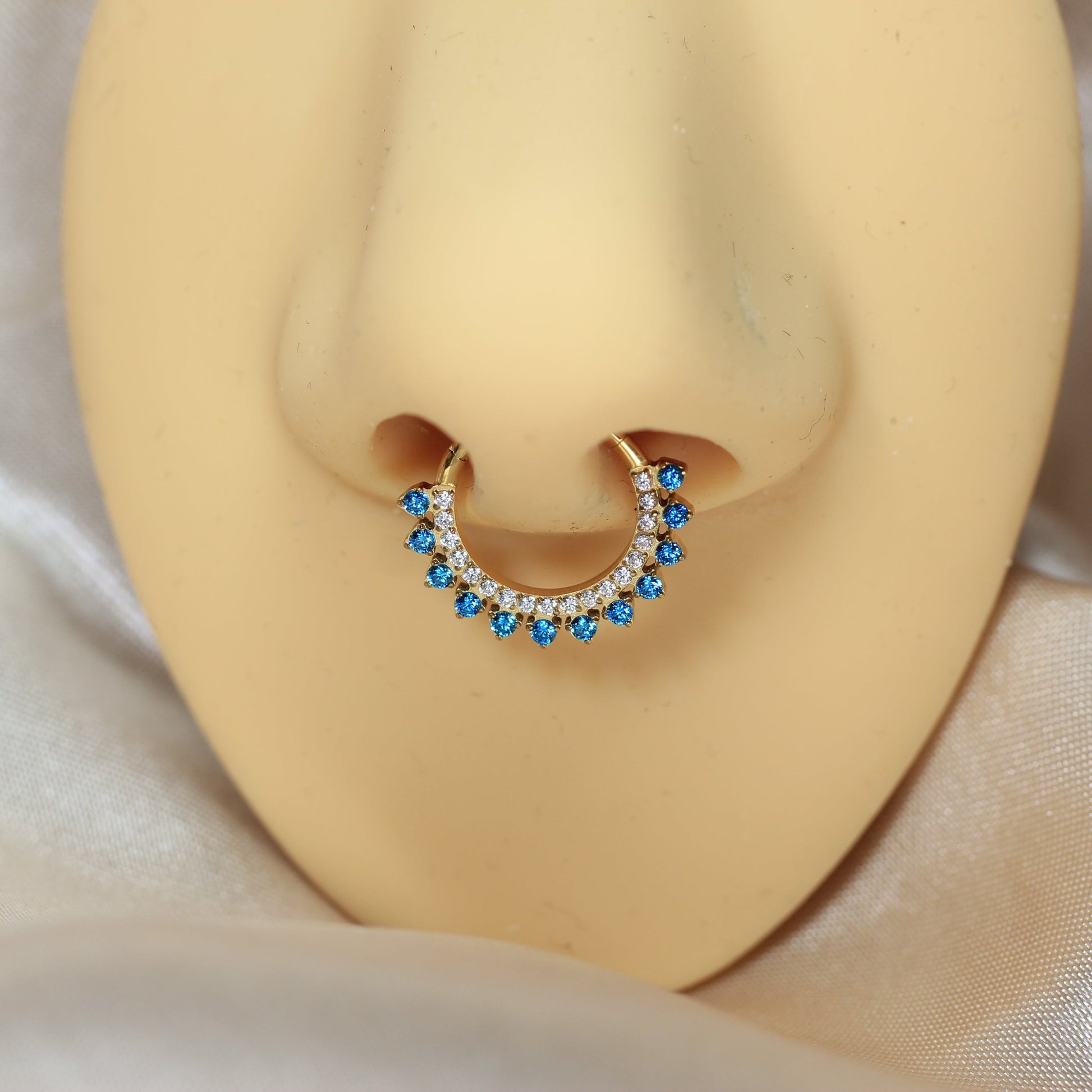 MKBodyJewelry gold titanium septum clicker ring with blue topaz and clear cz stones. 16g, 8mm/10mm.
