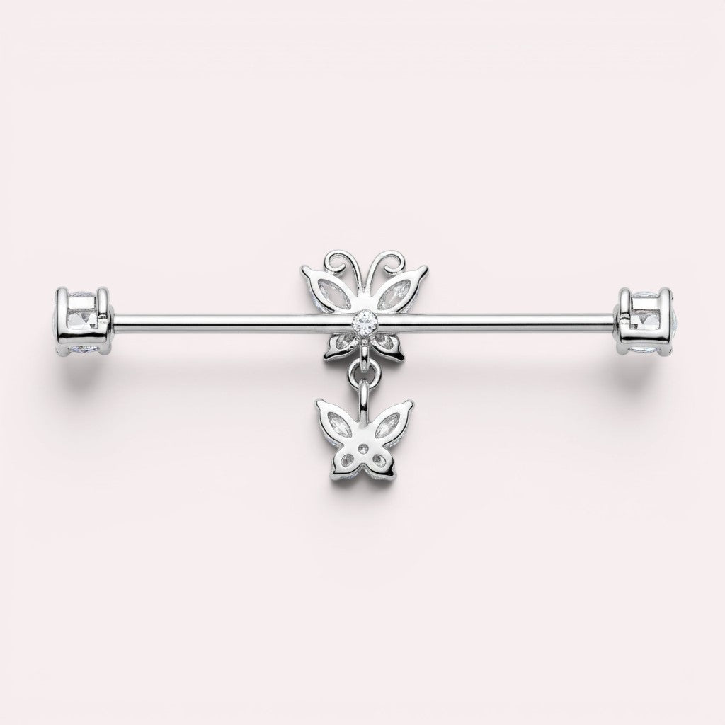 MKBodyJewelry silver surgical steel industrial barbell with dangling butterfly charms and clear cubic zirconia ends.