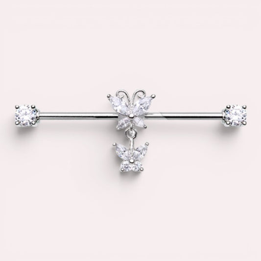 MKBodyJewelry silver surgical steel industrial barbell with dangling butterfly charms and clear cubic zirconia ends.
