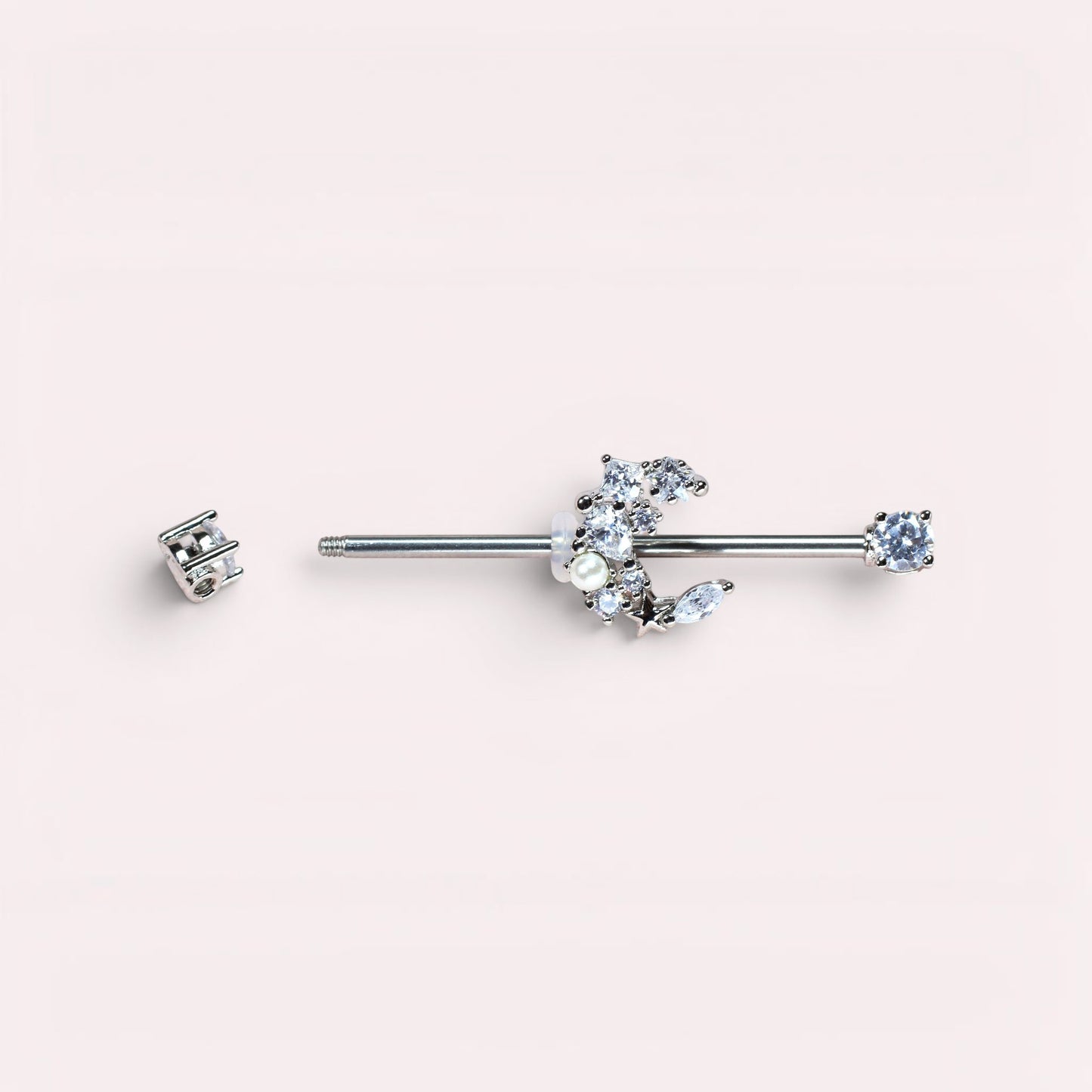 MKBodyJewelry 14G surgical steel industrial barbell with a crescent moon charm adorned with cubic zirconia and pearls.