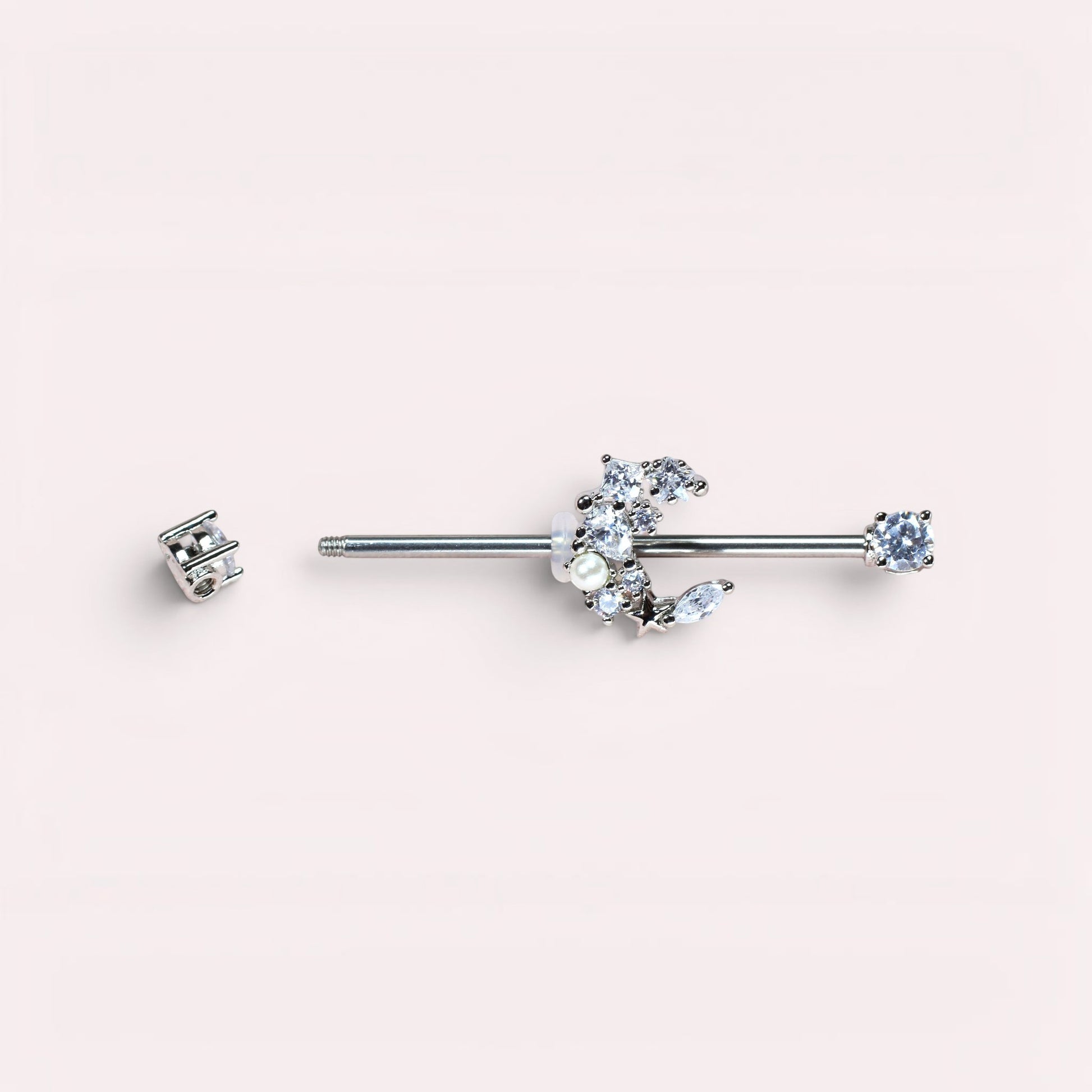 MKBodyJewelry 14G surgical steel industrial barbell with a crescent moon charm adorned with cubic zirconia and pearls.