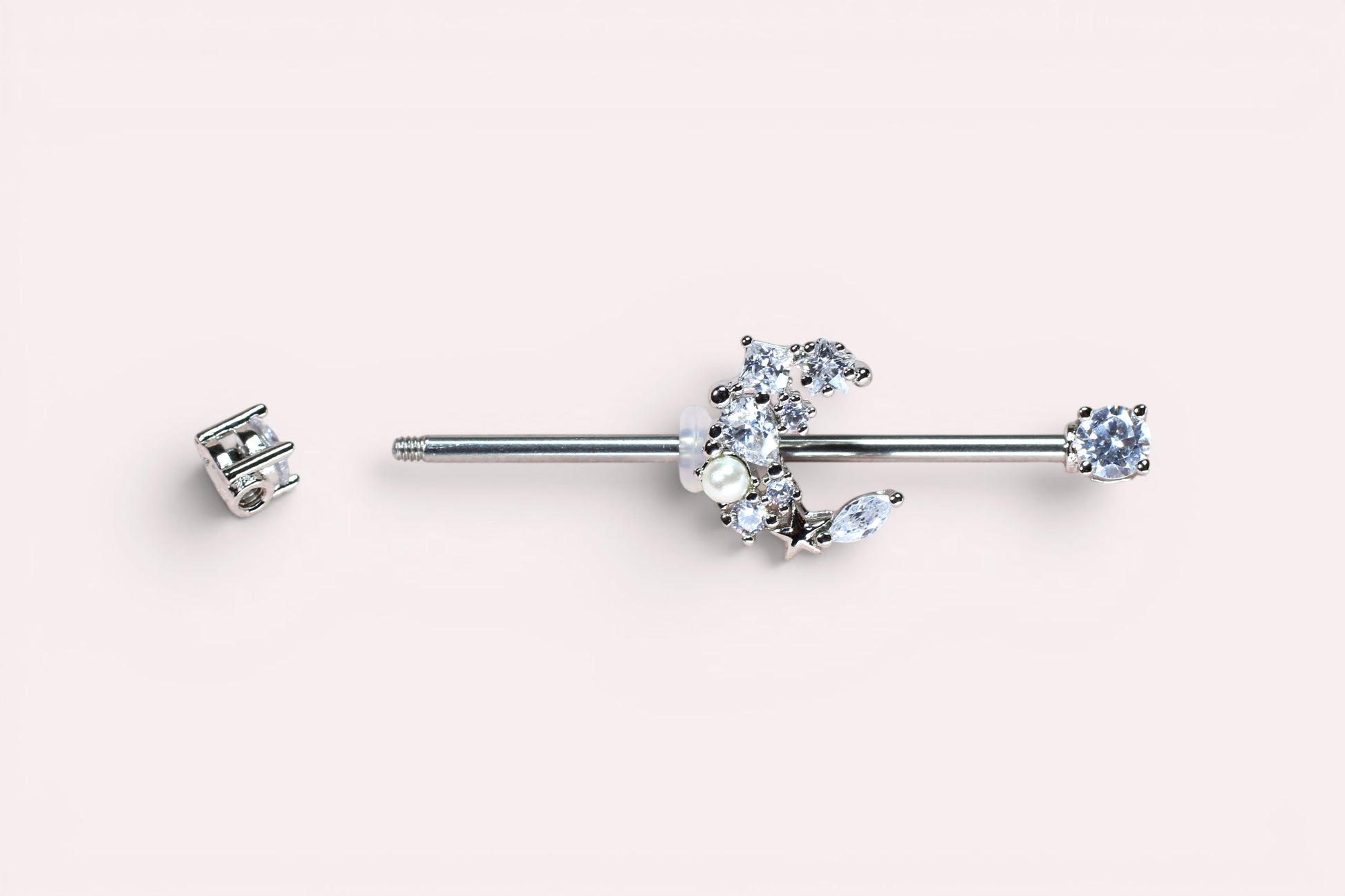 MKBodyJewelry 14G surgical steel industrial barbell with a crescent moon charm adorned with cubic zirconia and pearls.