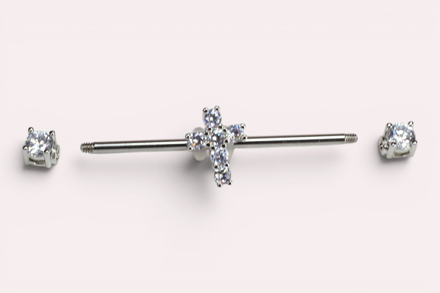MKBodyJewelry 14G surgical steel industrial barbell with a sparkling Jesus cross charm and clear cubic zirconia ends.