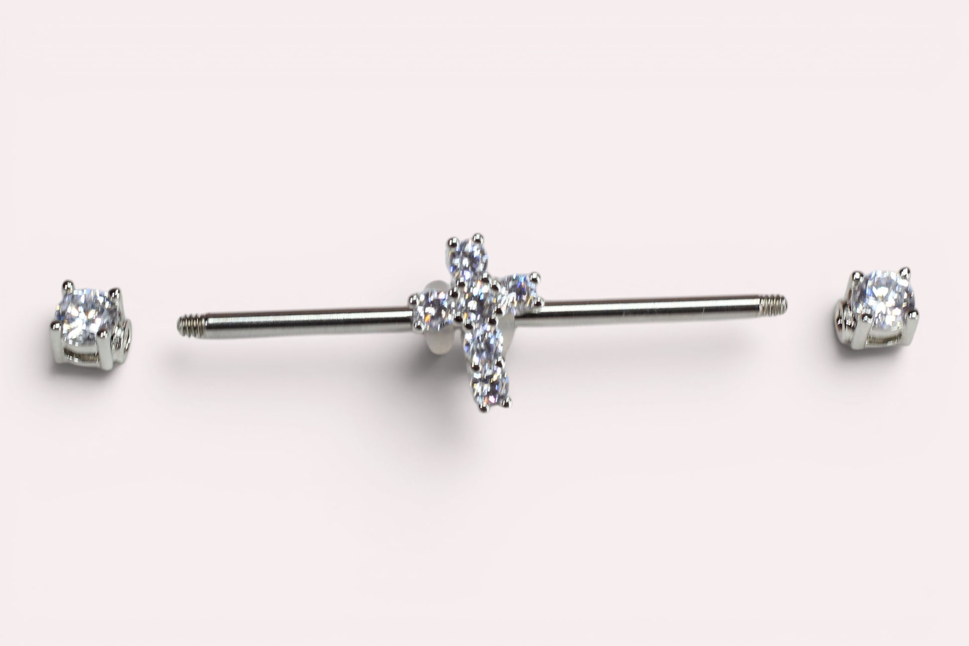 MKBodyJewelry 14G surgical steel industrial barbell with a sparkling Jesus cross charm and clear cubic zirconia ends.