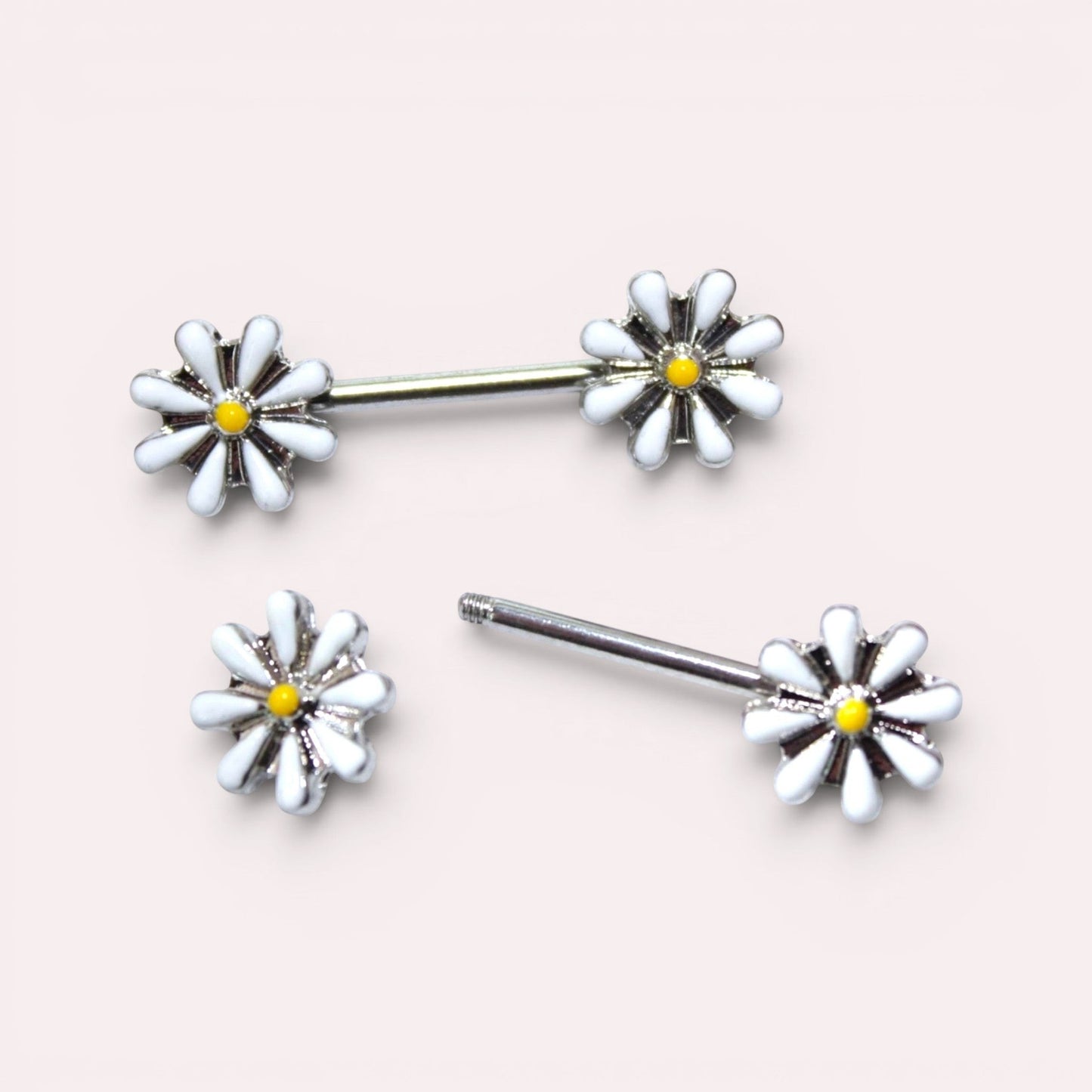 MKBodyJewelry 14G surgical steel nipple barbell set featuring white and yellow daisy flower charms.