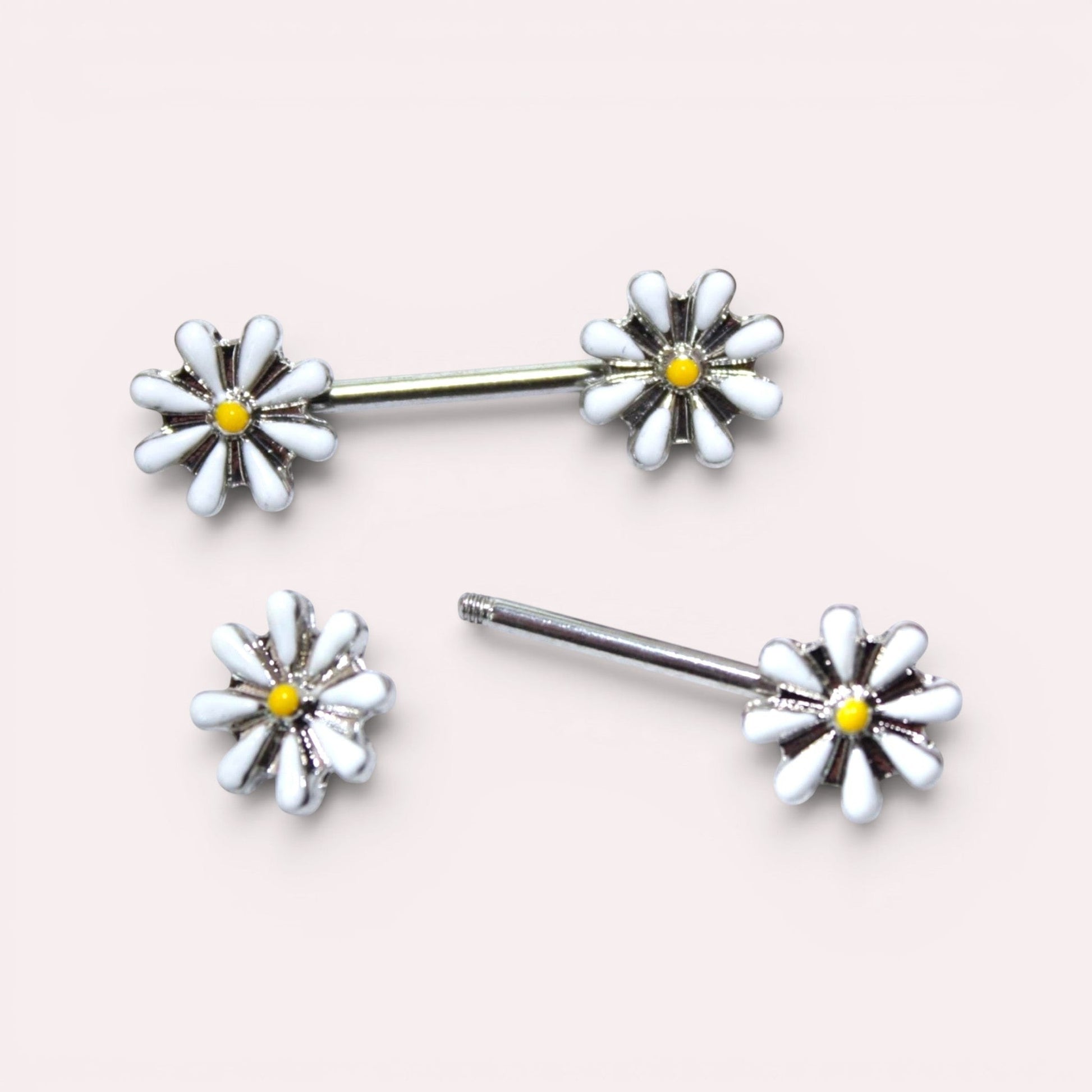 MKBodyJewelry 14G surgical steel nipple barbell set featuring white and yellow daisy flower charms.