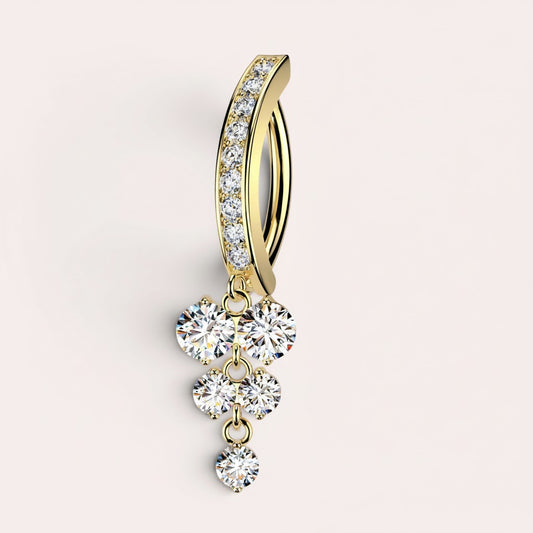MKBodyJewelry 14k yellow gold belly button ring with a curved barbell adorned with cubic zirconia and a tiered dangle of five round gems.
