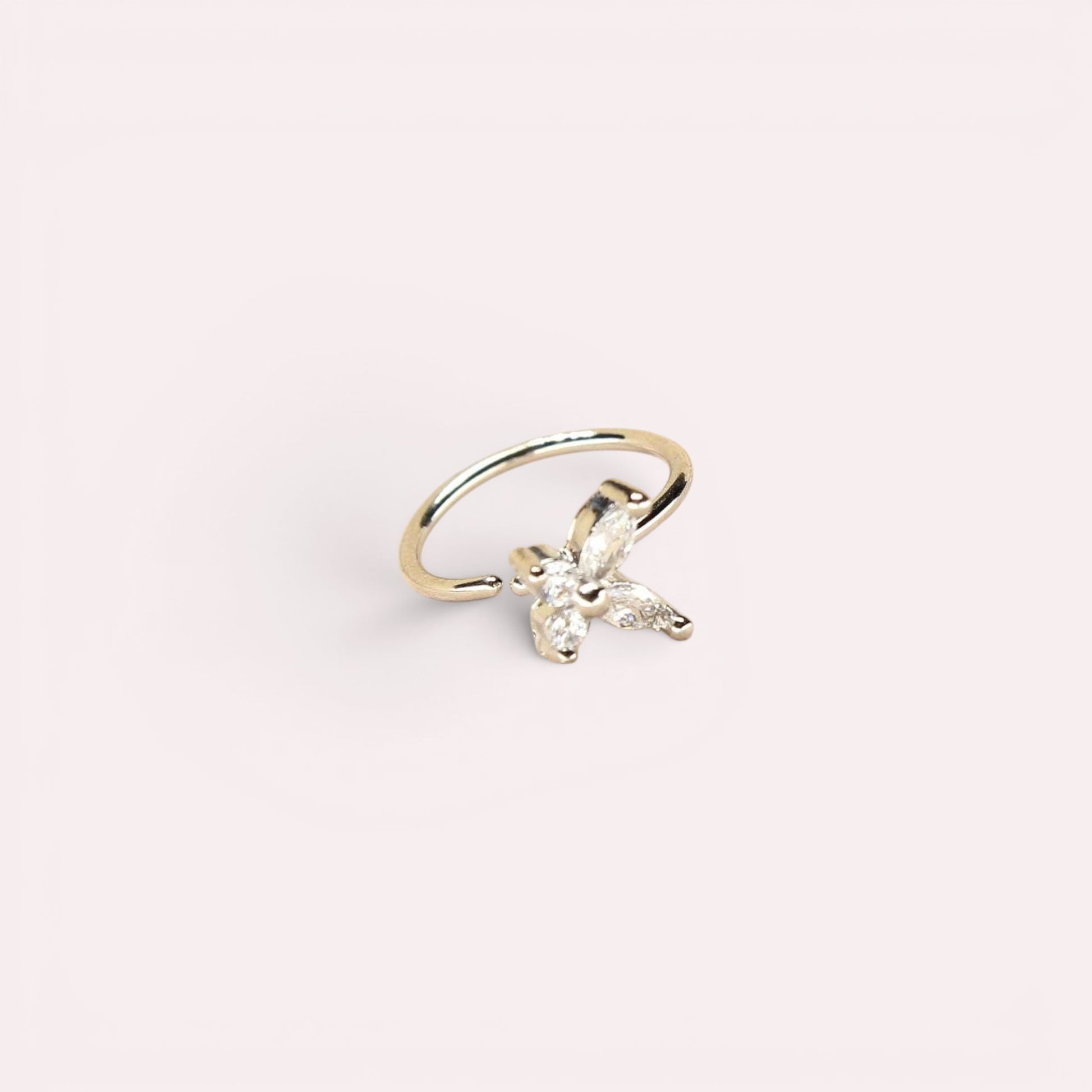 MKBodyJewelry gold 20g surgical steel nose hoop featuring a dainty CZ butterfly charm for minimalist piercing jewelry.