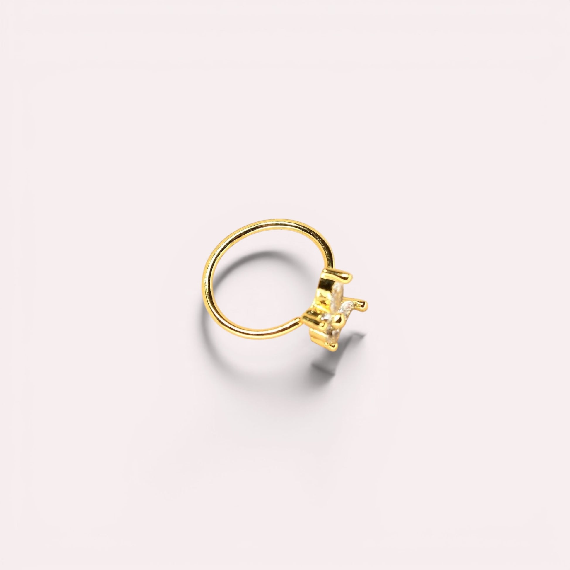 MKBodyJewelry gold surgical steel nose hoop featuring a dainty CZ butterfly charm, 20g minimalist body jewelry.