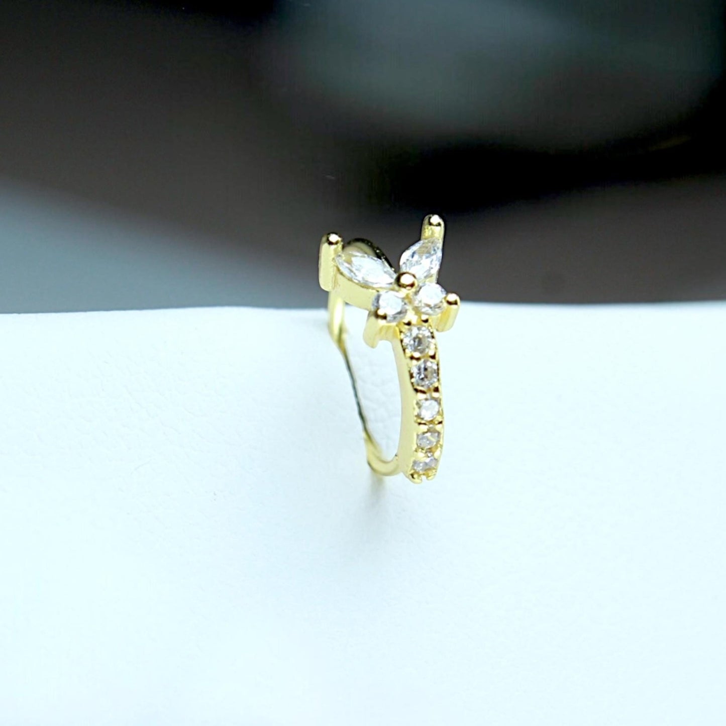 MKBodyJewelry gold surgical steel nose hoop featuring a sparkling cubic zirconia butterfly design for piercings