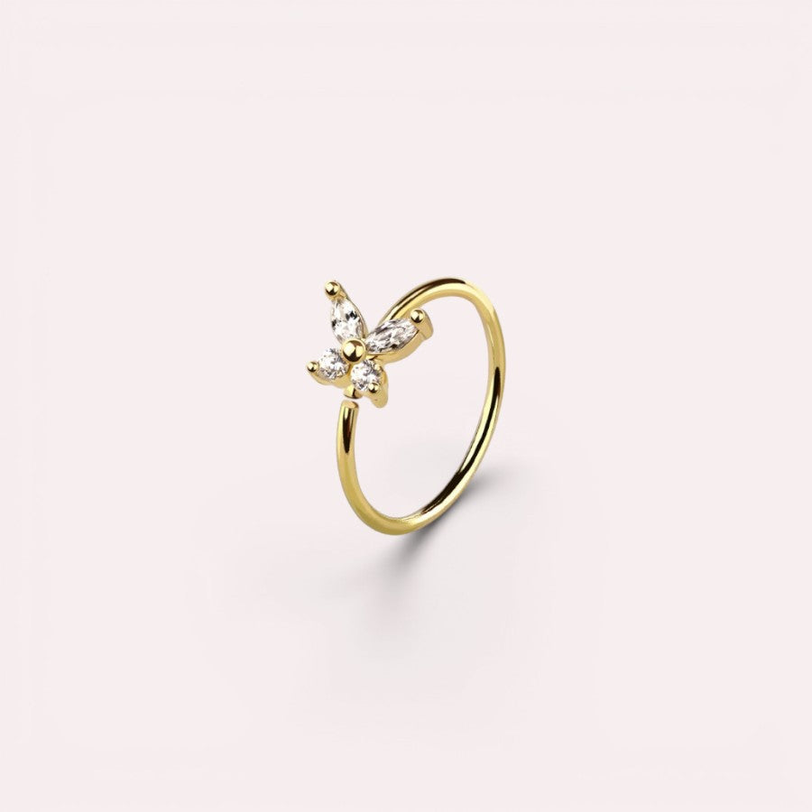MKBodyJewelry gold 20g surgical steel nose hoop featuring a dainty CZ butterfly charm for minimalist piercing jewelry