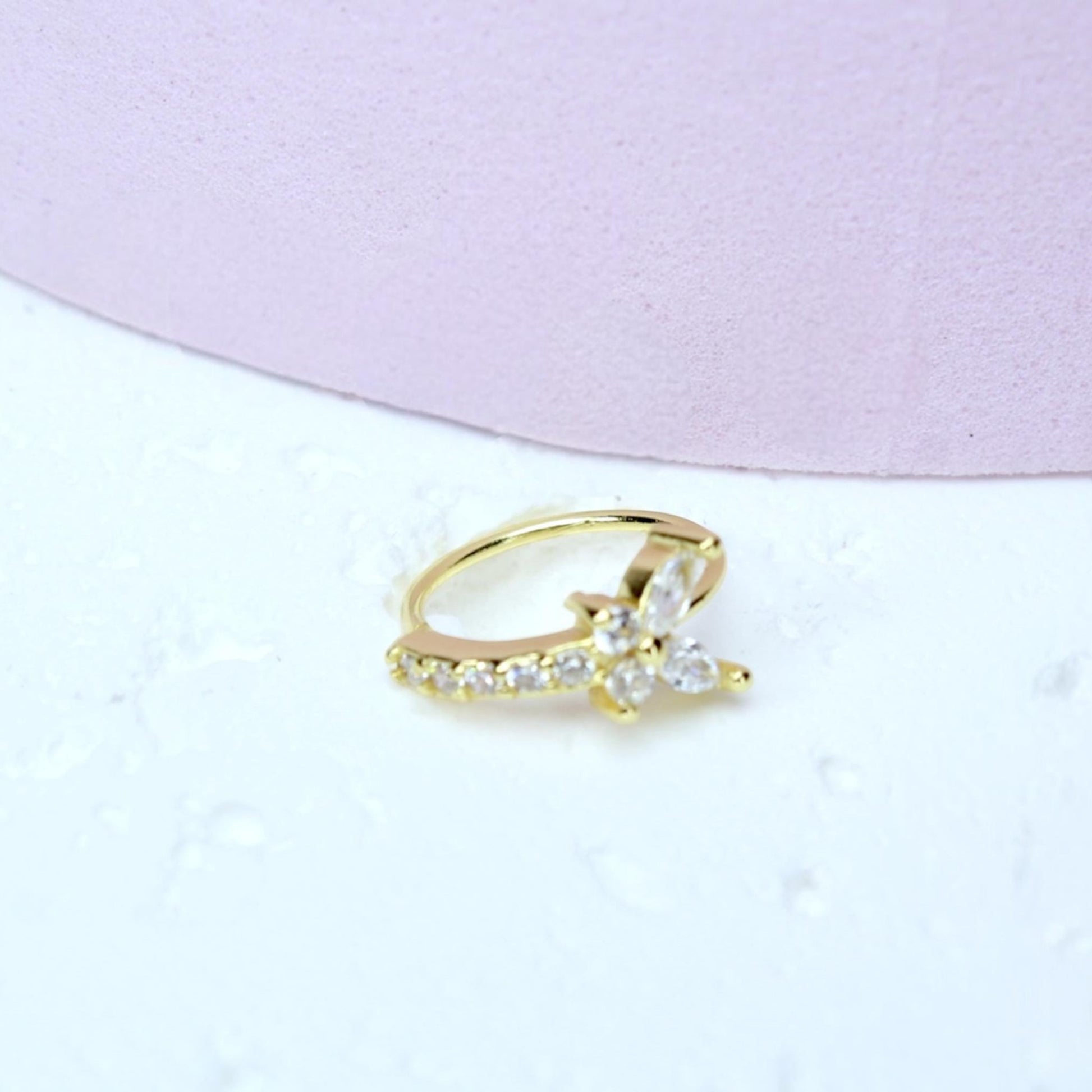 MKBodyJewelry gold surgical steel nose hoop featuring a sparkling cubic zirconia butterfly design for piercings