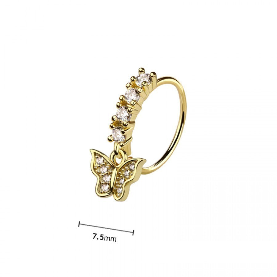 MKBodyJewelry gold surgical steel nose hoop featuring a dangling butterfly charm with clear gems and a gem-set band.
