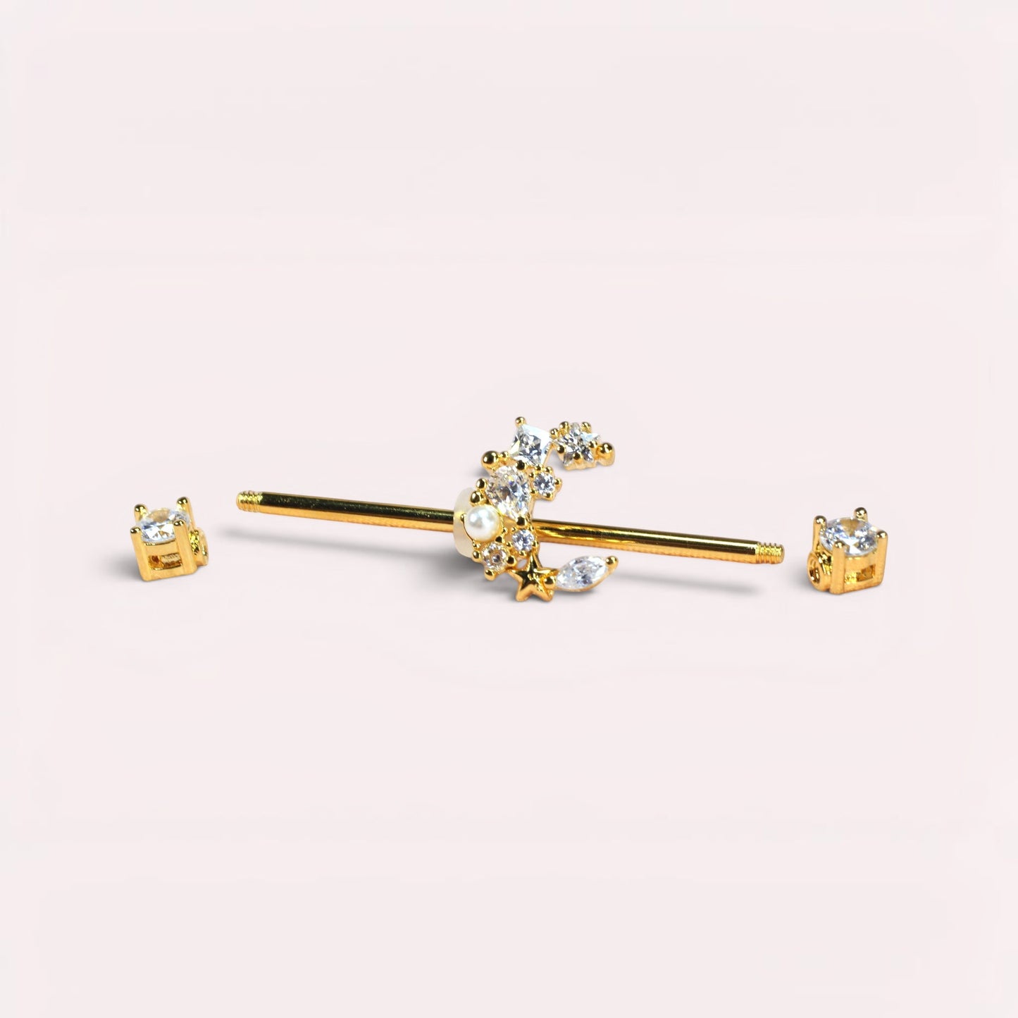 MKBodyJewelry gold industrial barbell with a crescent moon charm adorned with crystals and a pearl. Surgical steel.