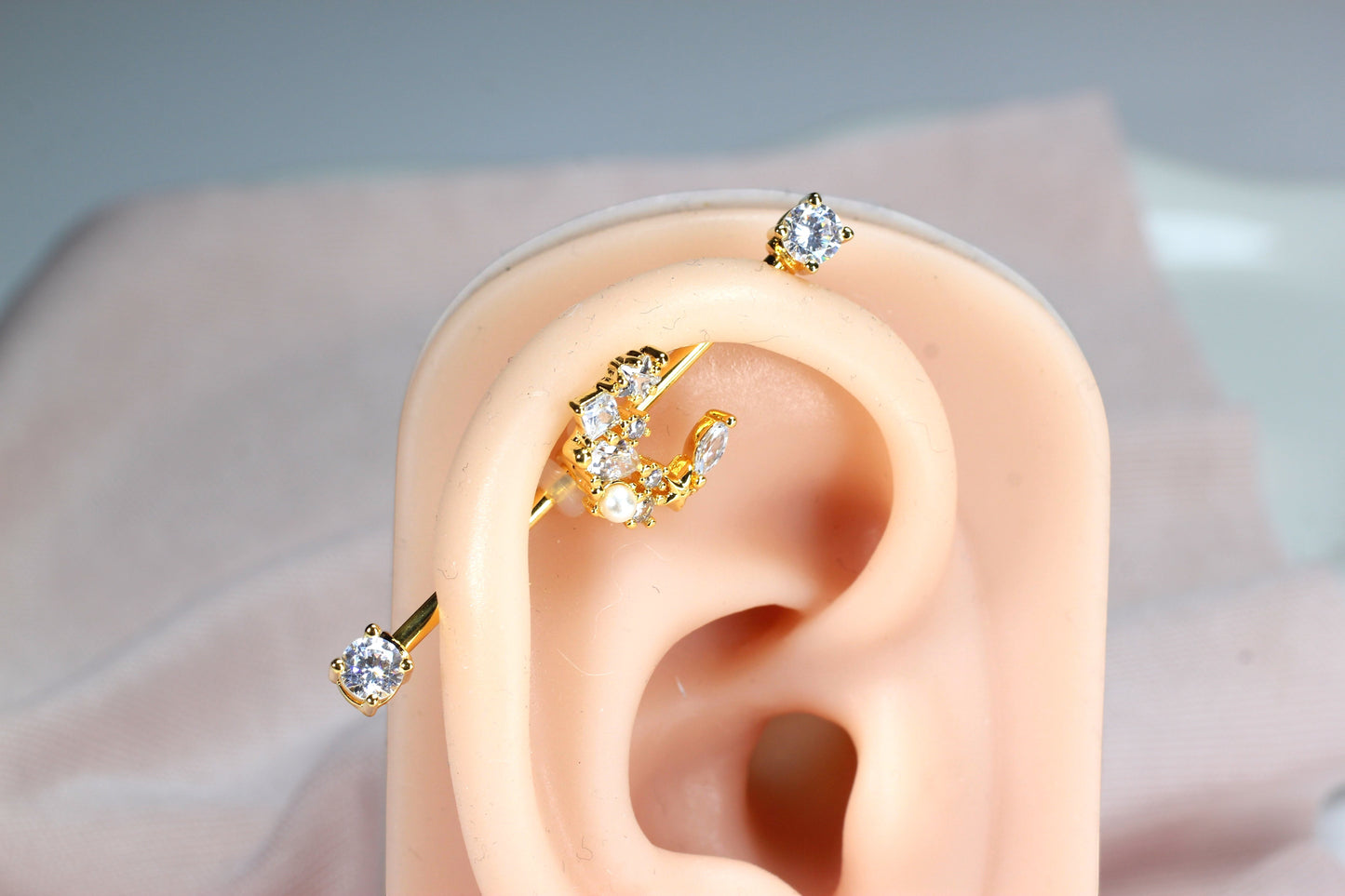 MKBodyJewelry gold crescent moon industrial barbell with clear cubic zirconia and pearl accents, 14G surgical steel