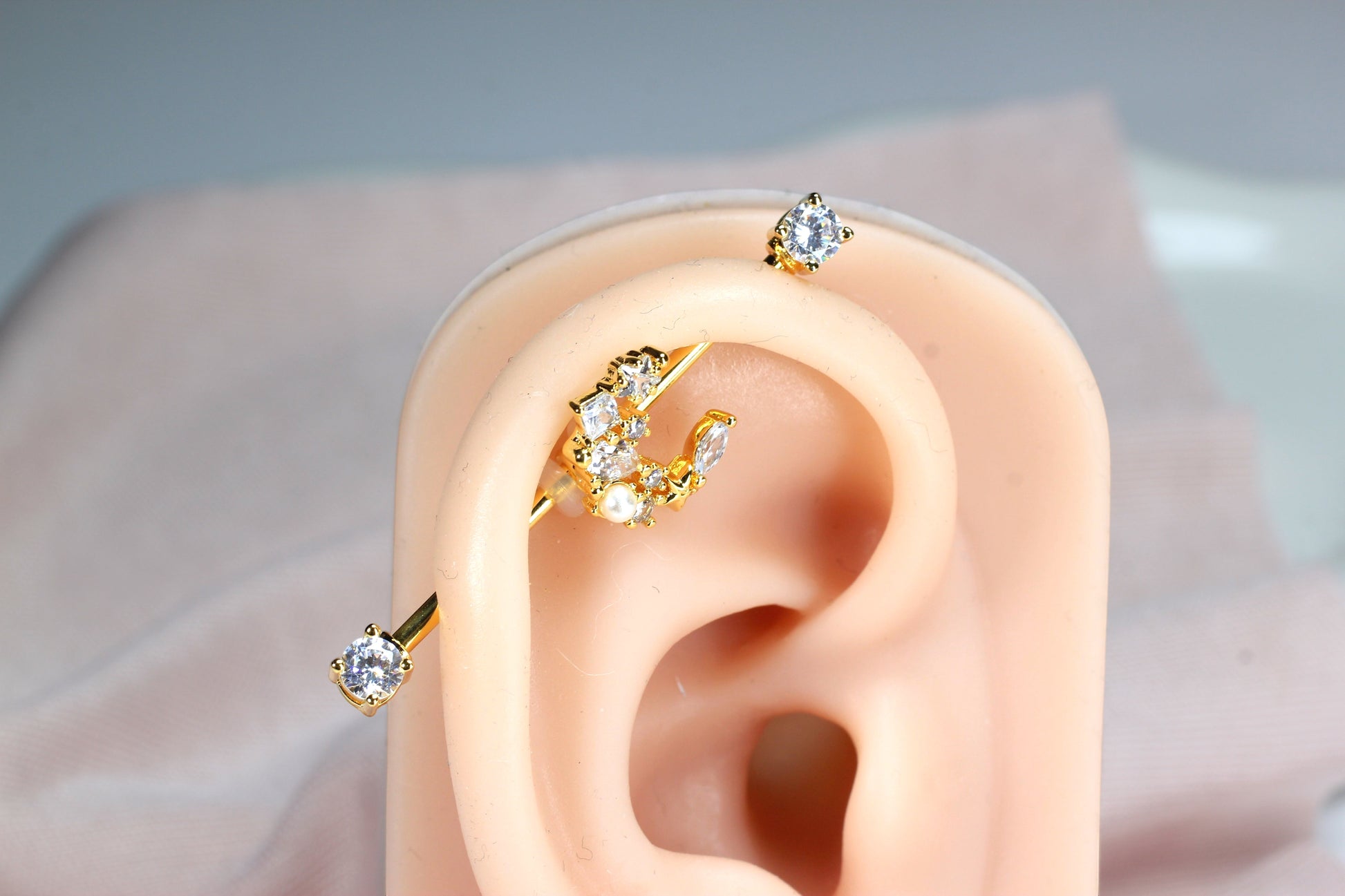 MKBodyJewelry gold crescent moon industrial barbell with clear cubic zirconia and pearl accents, 14G surgical steel