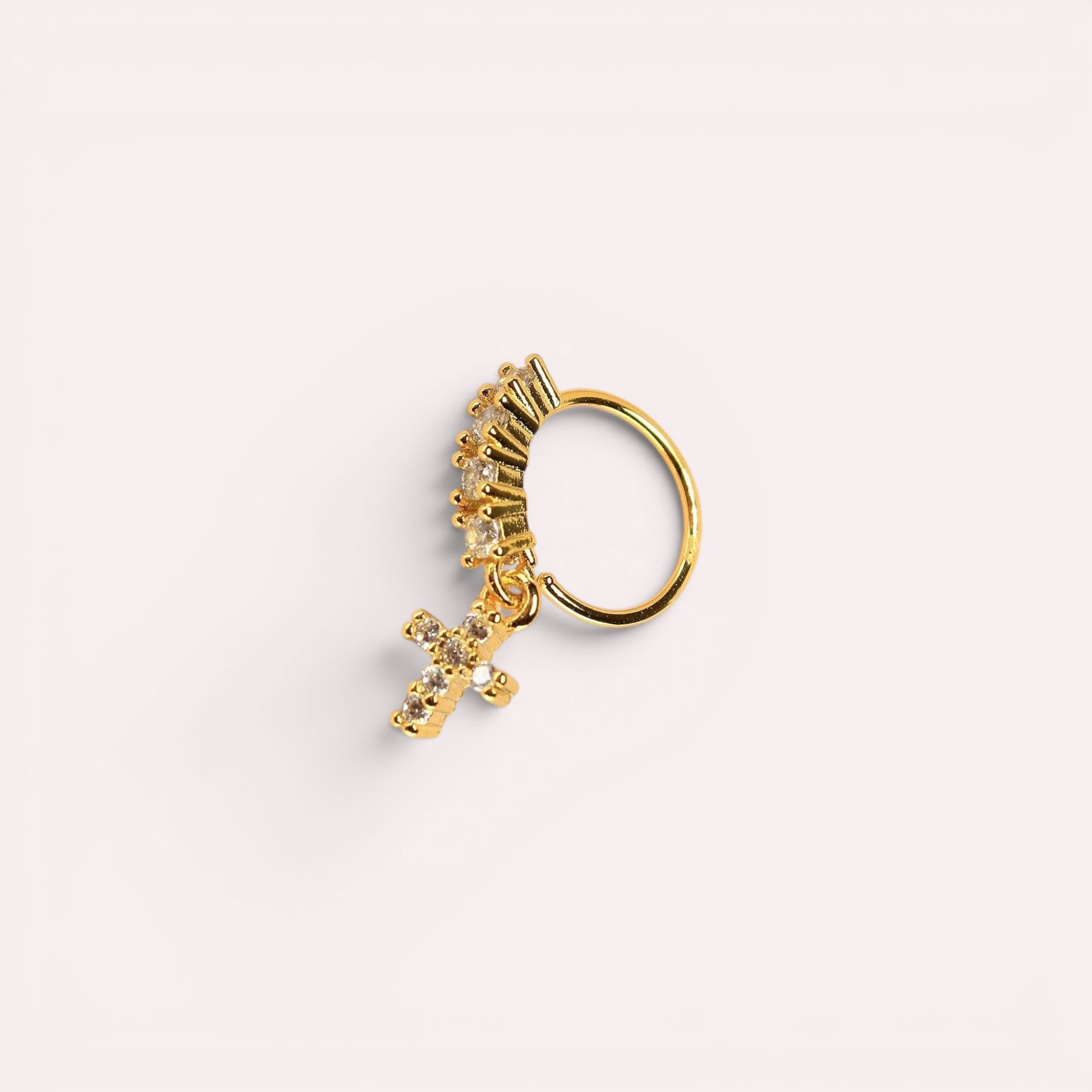 MKBodyJewelry 20g gold surgical steel nose hoop with a dangling CZ cross charm and crystal accents.
