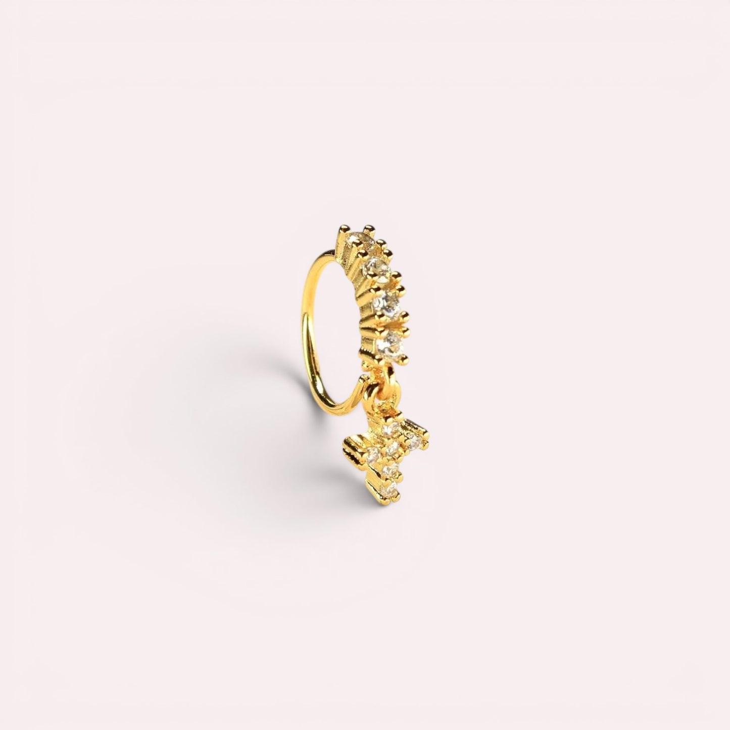 MKBodyJewelry 20g gold surgical steel nose hoop with dangling CZ cross charm and crystal accents.