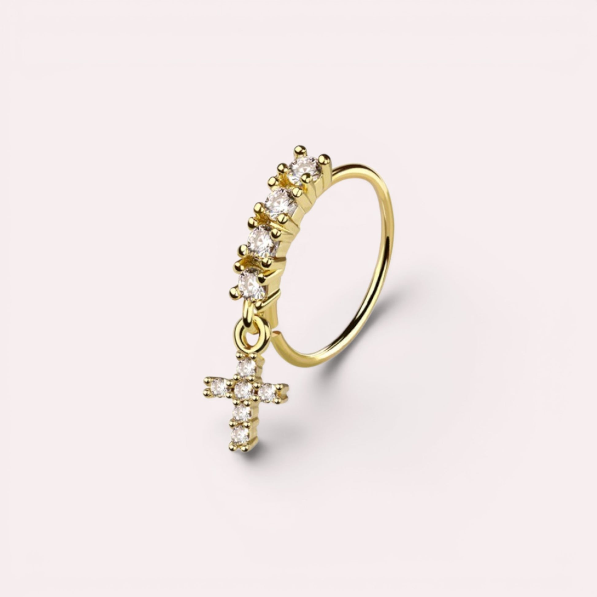 MKBodyJewelry 20g gold surgical steel nose hoop with a dangling CZ cross charm and crystal accents.