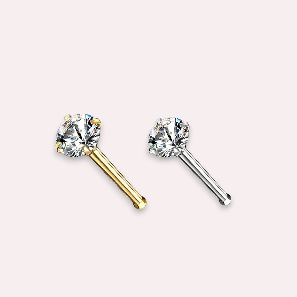 MKBodyJewelry gold-tone nose stud with a round-cut cubic zirconia stone in a classic four-prong setting.