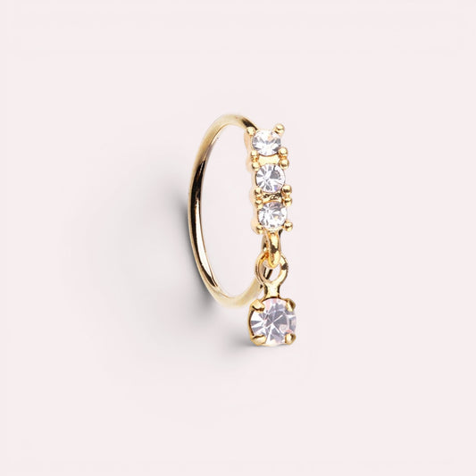 MKBodyJewelry 20g gold surgical steel nose hoop with sparkling CZ crystals and a delicate dangling gem charm.