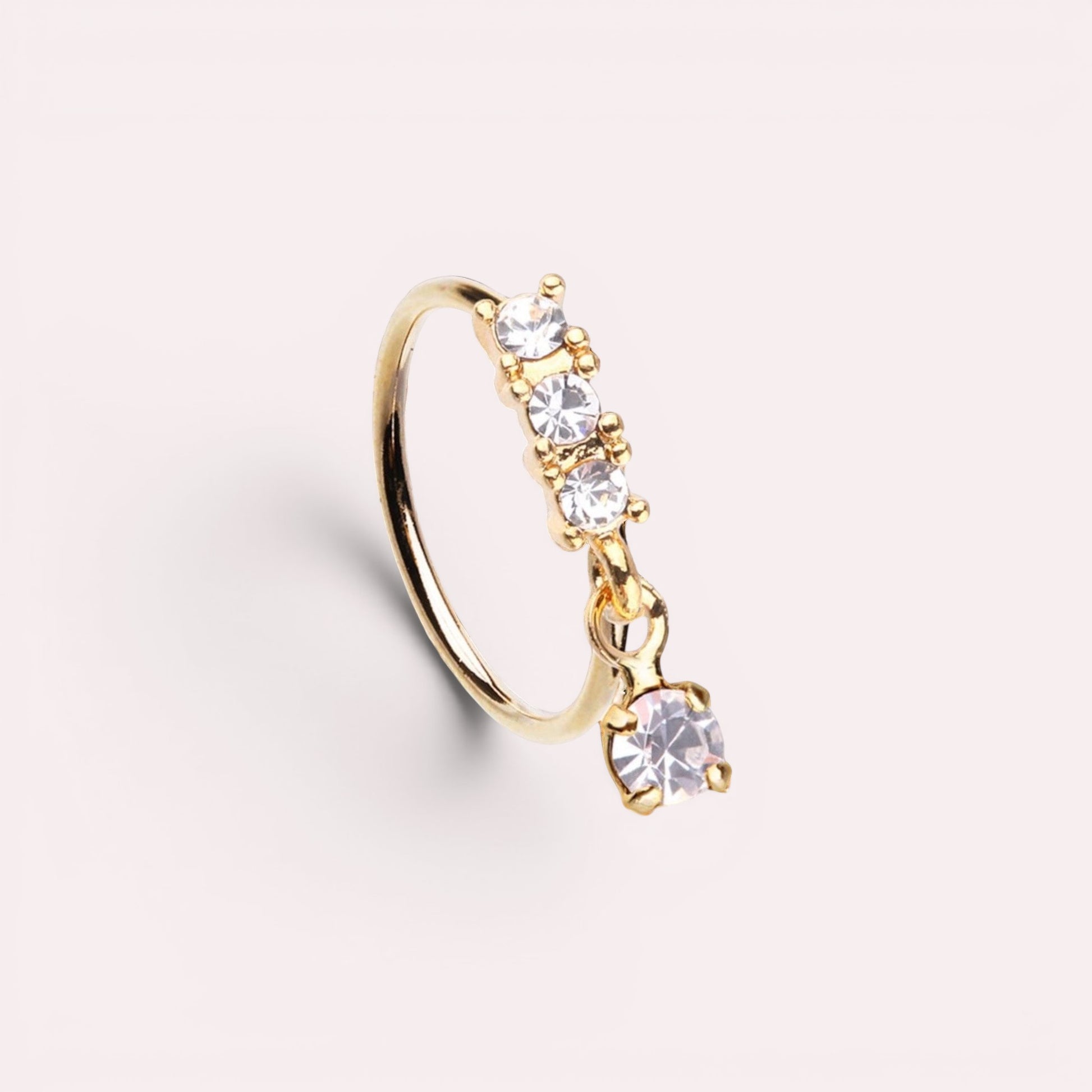MKBodyJewelry 20g gold surgical steel nose hoop with three fixed CZ stones and one dangling sparkling CZ gem.