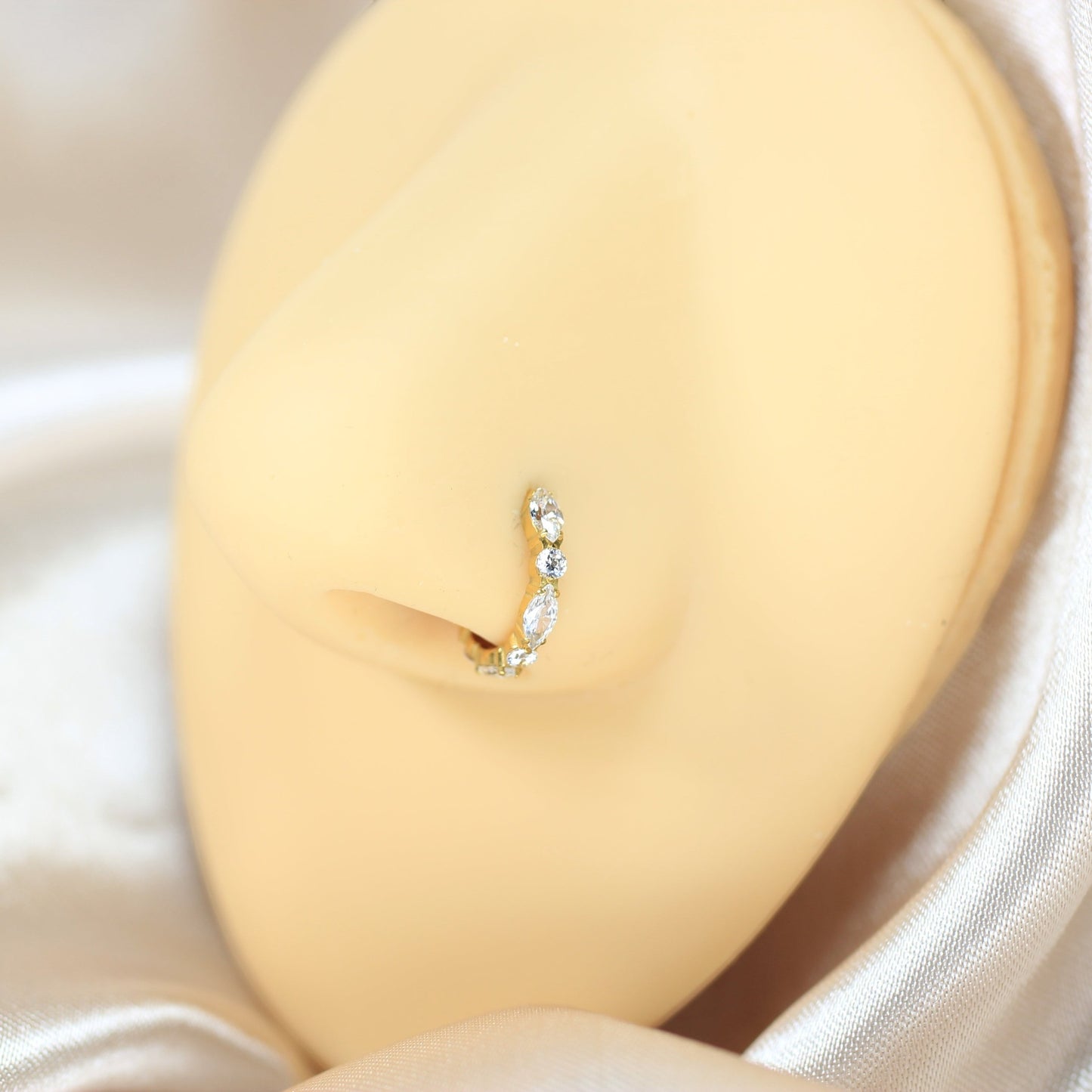 MKBodyJewelry gold titanium nose clicker ring featuring sparkling CZ gems on a minimalist hinged hoop