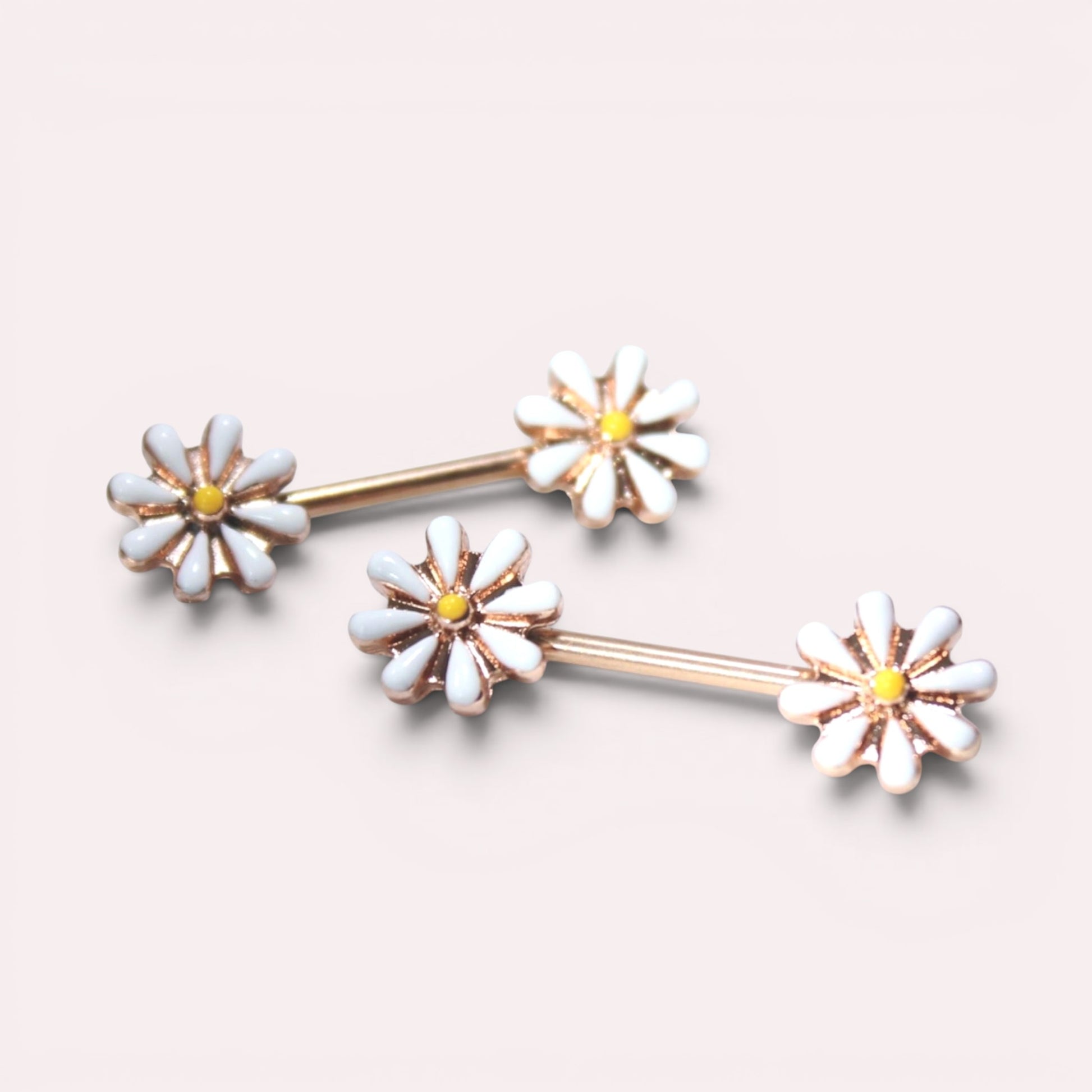 MKBodyJewelry 14G gold surgical steel nipple barbells featuring white and yellow daisy flower designs, sold as a pair.