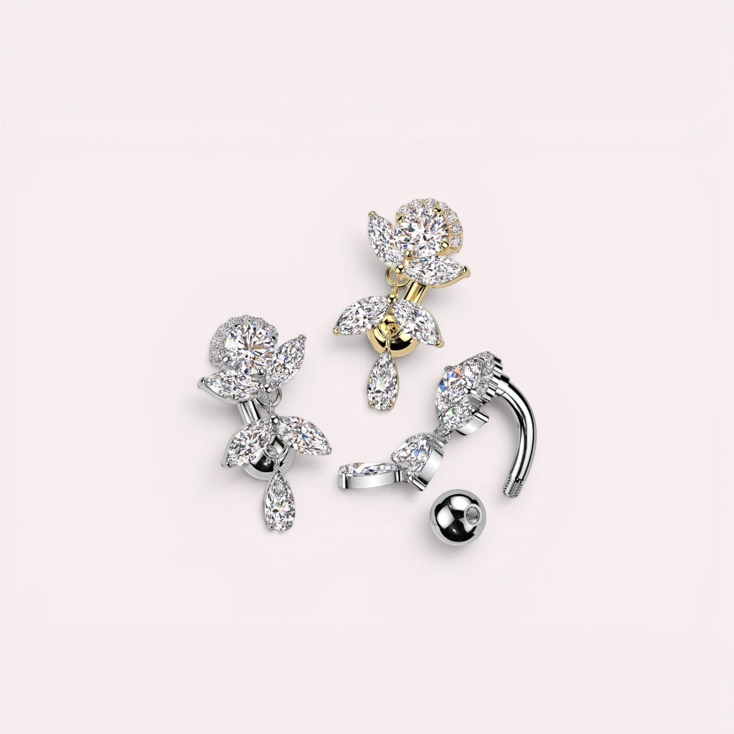 MKBodyJewelry gold inverted floral titanium belly button ring with CZ stones and a dangling pear-shaped charm.