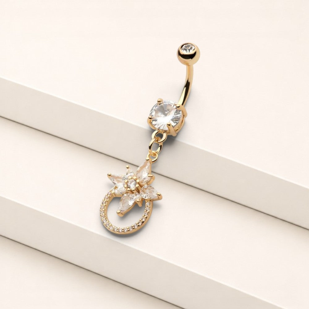 MKBodyJewelry 14g gold surgical steel belly button ring featuring a dangling floral charm with sparkling CZ stones.