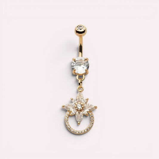MKBodyJewelry 14g gold surgical steel belly button ring with a dangling floral charm and sparkling CZ stones.